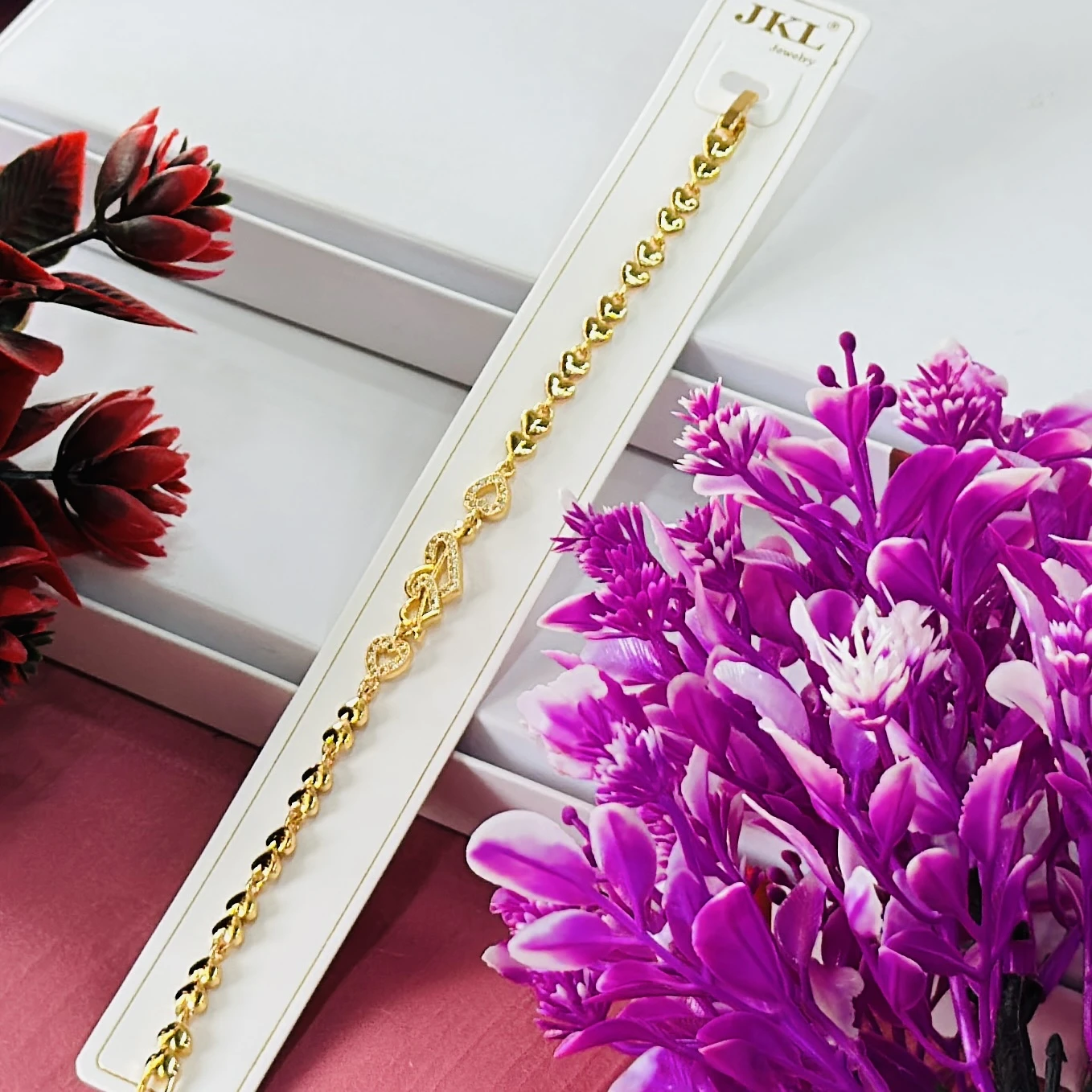 Gold -toned heart-link bracelet.