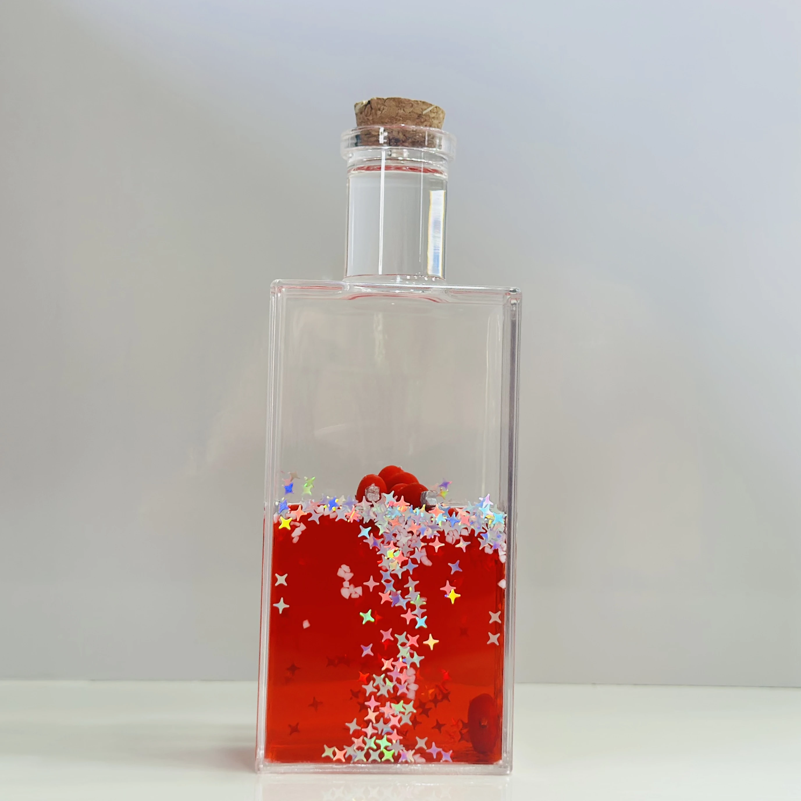 decorative fluid bottle with hearts and stars. (SKU-S4IER4)