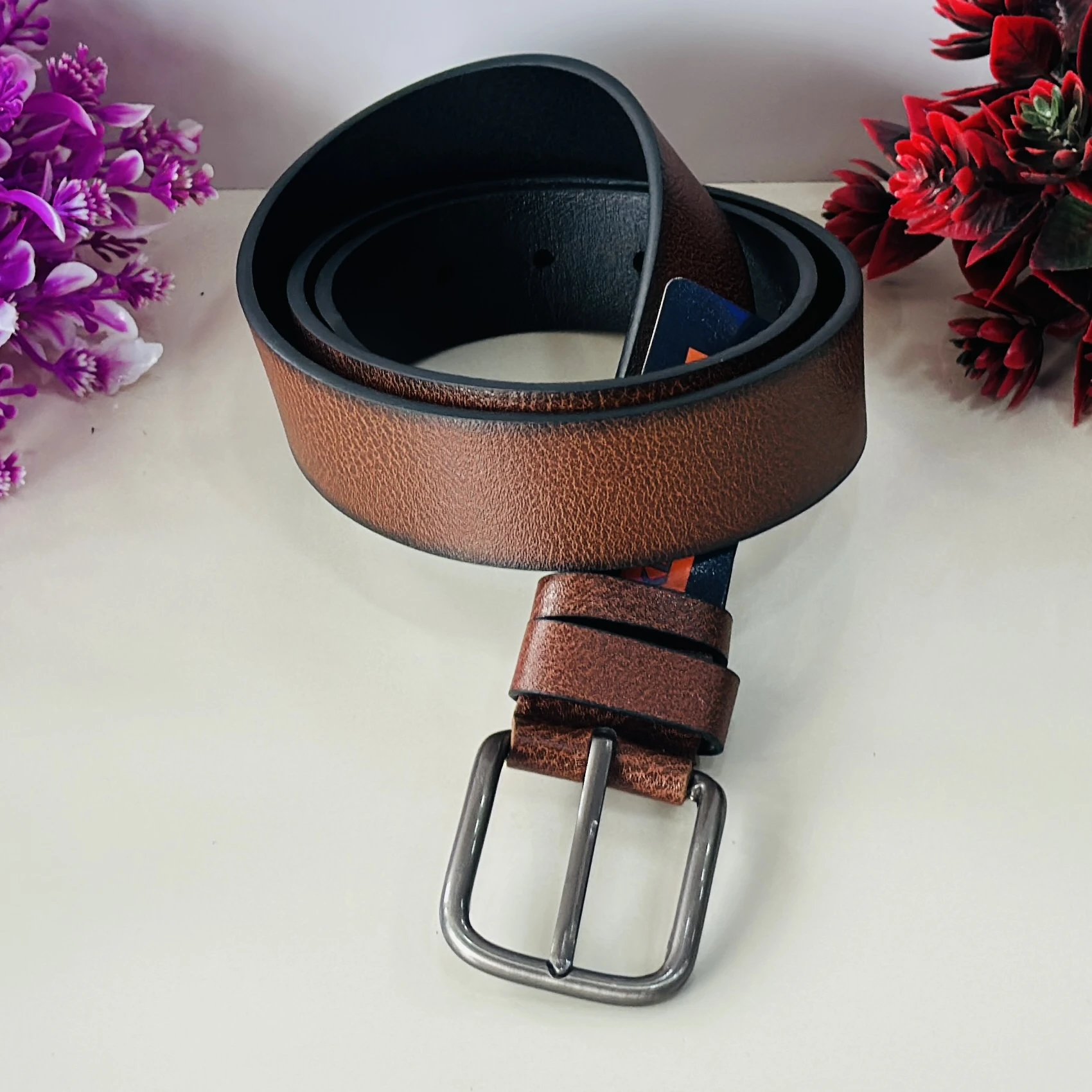 Brown leather belt by Kevin Ford