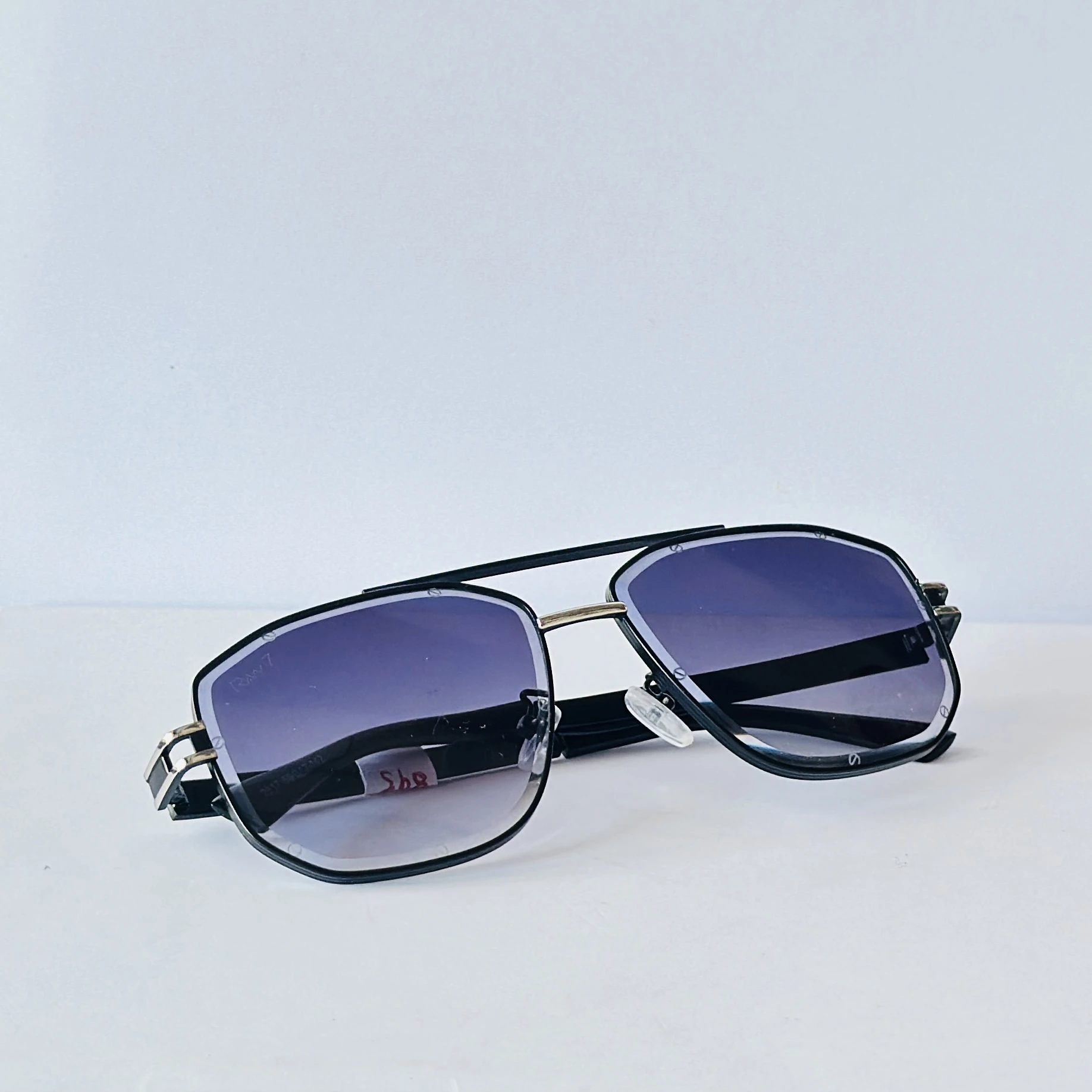 pair of Raw 7 branded men's rectangular sunglasses