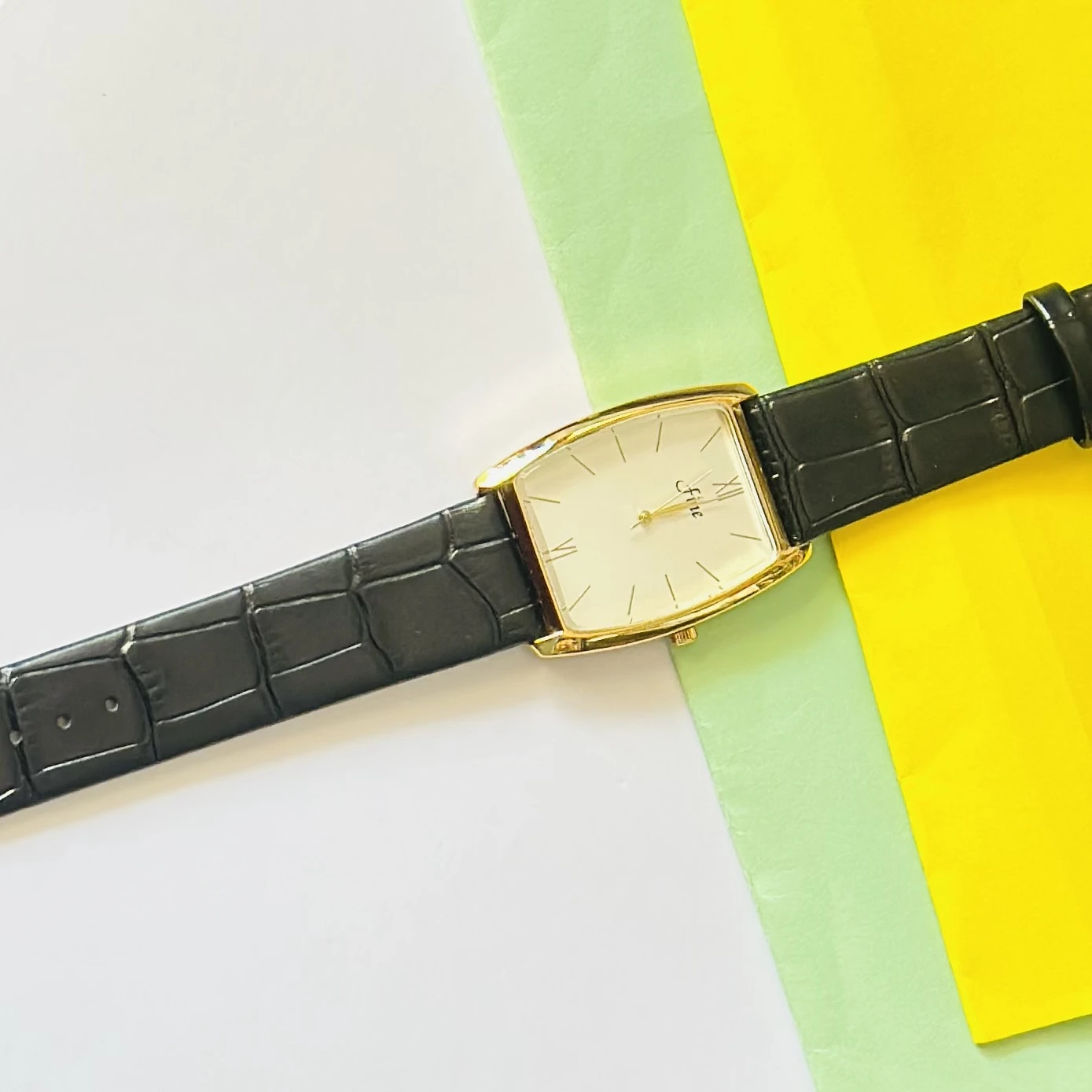 Edge quartz analog white dial black leather strap watch.