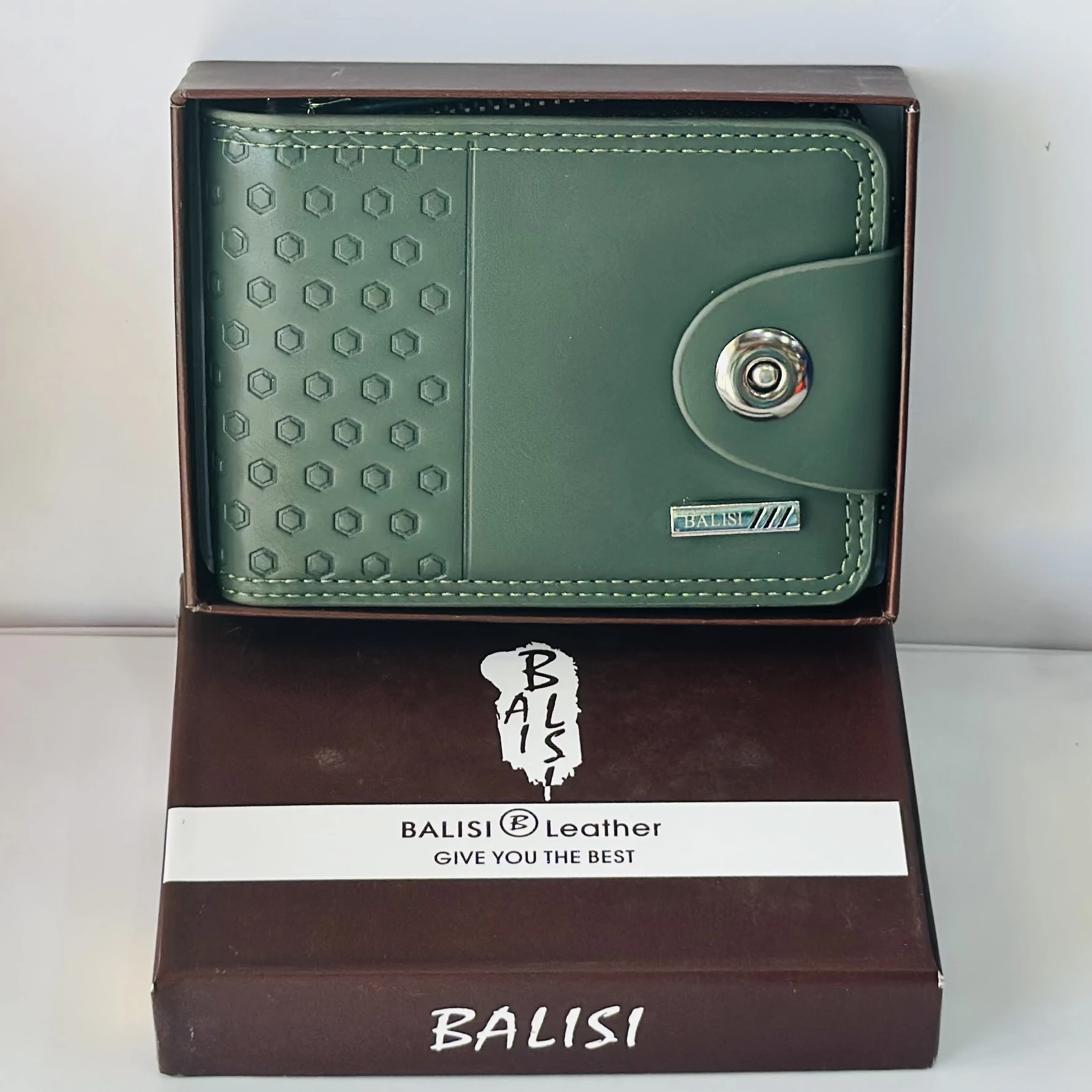 Balisi green leather wallet with a button closure.