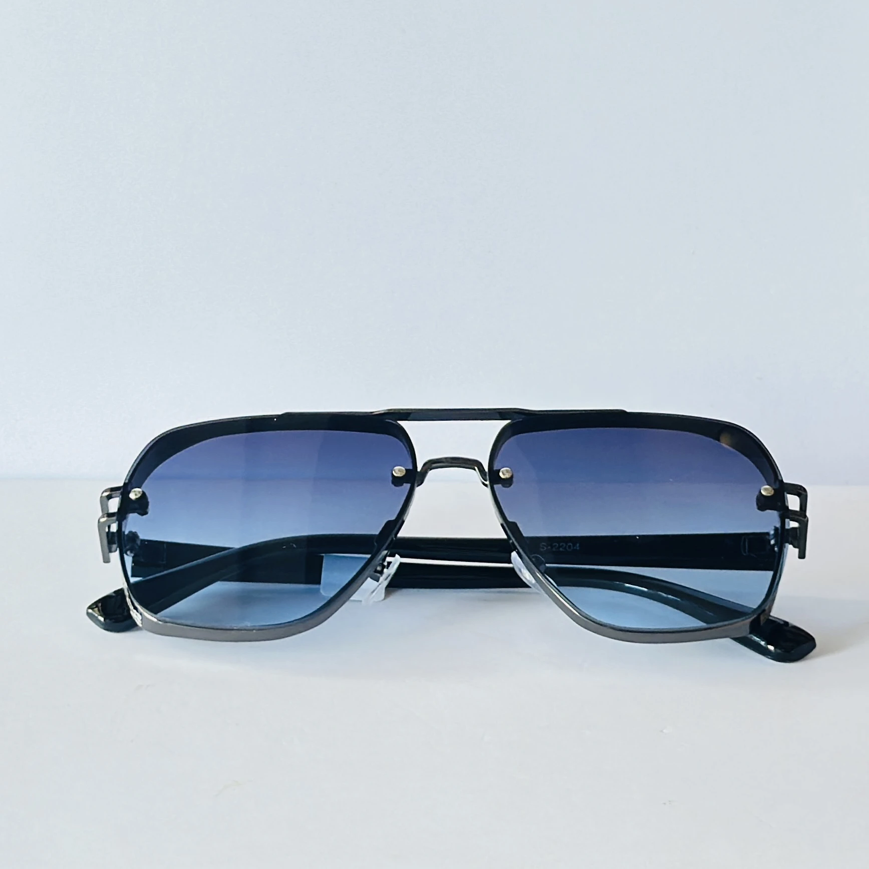 sunglasses appear to be the Maybach