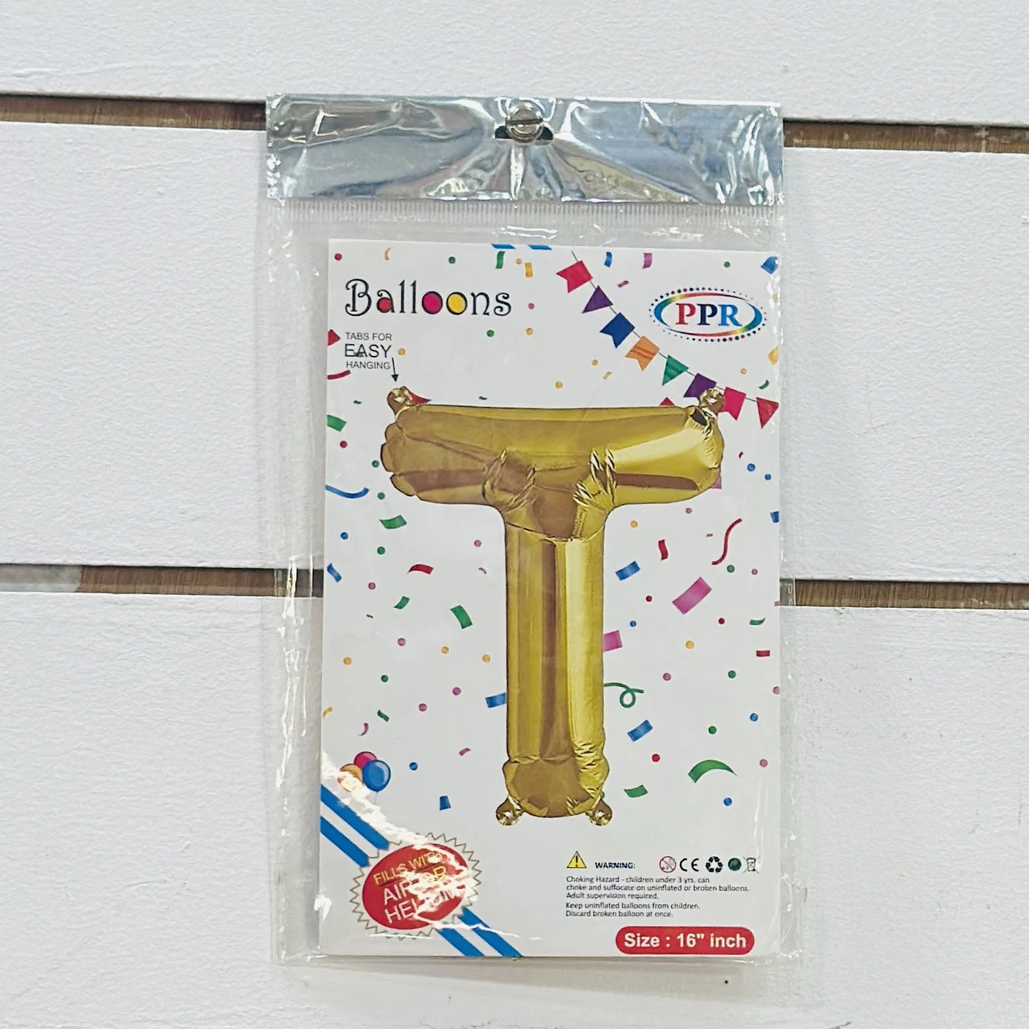 Gold foil letter "T” balloon