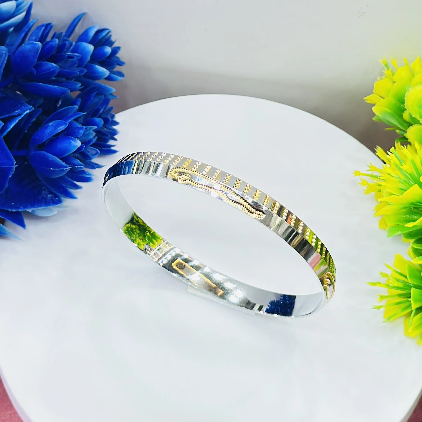 silver dual-tone men's kada with gold plating, featuring a polished finish.