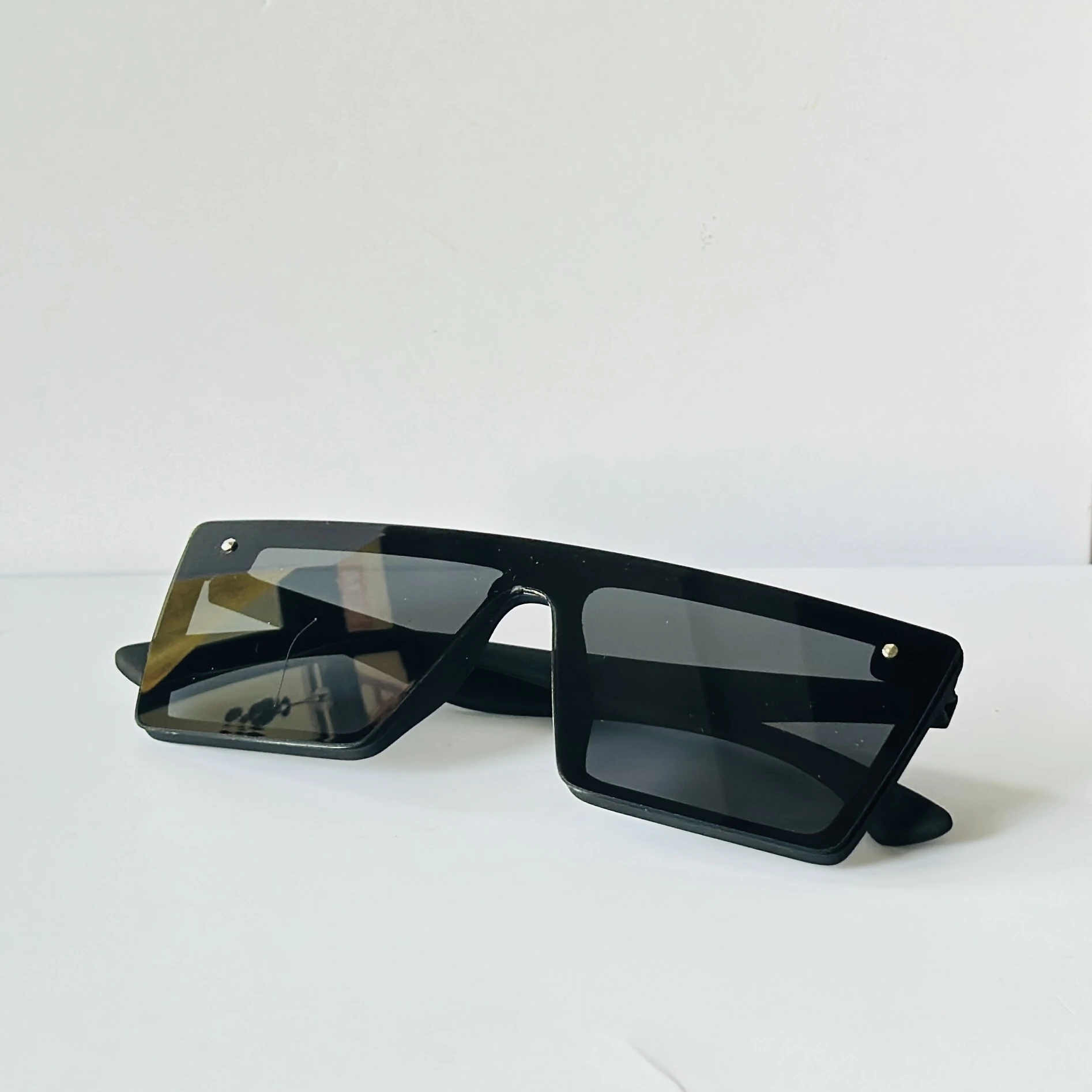 Black sunglasses are a retro square