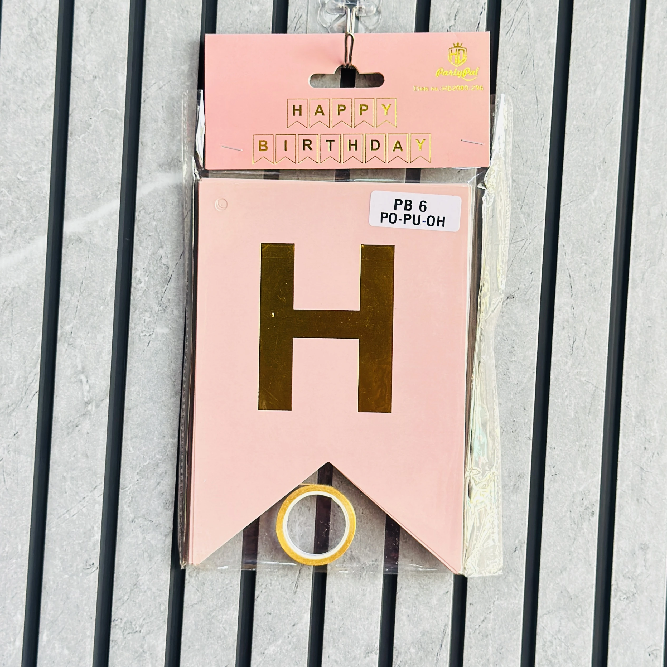 pink paper birthday banner with gold foil lettering