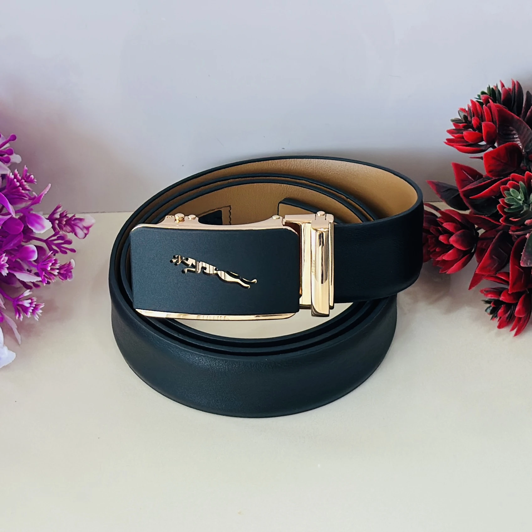 Black genuine or synthetic leather men's belt