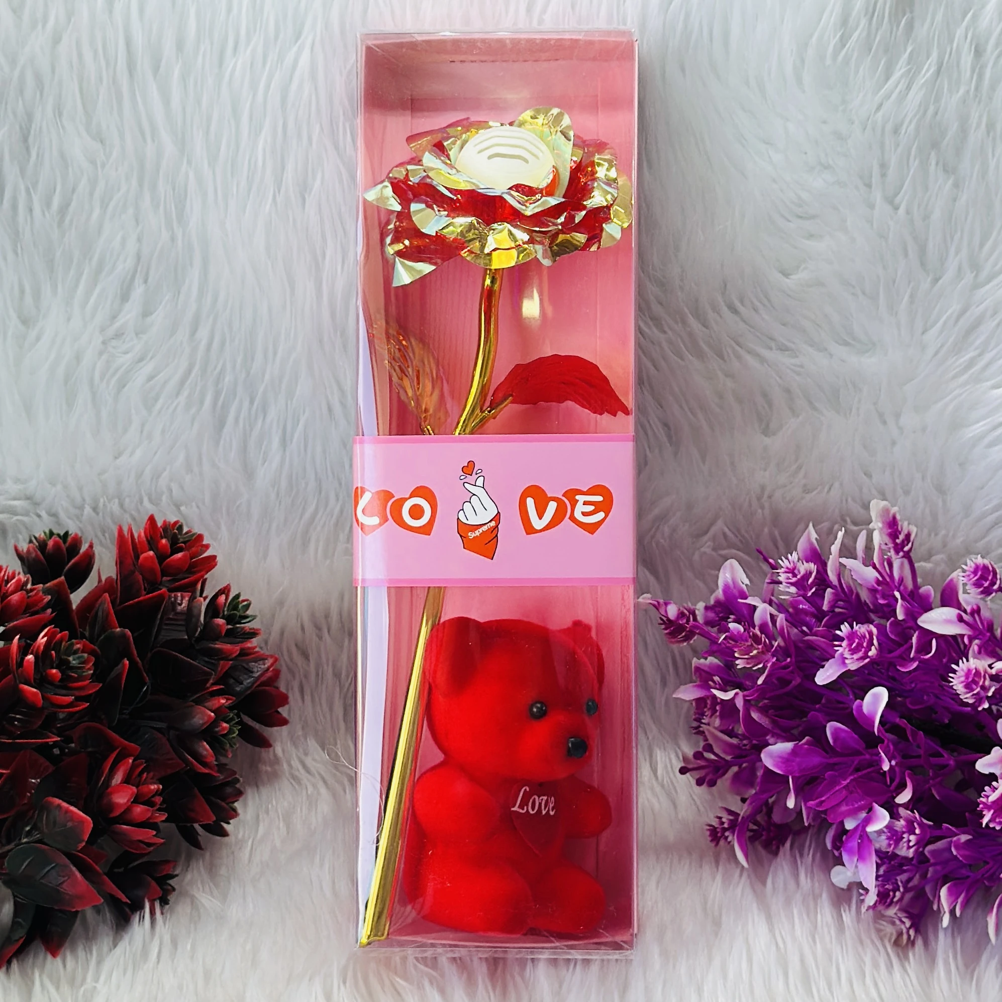 Gift set featuring an artificial golden rose and a red teddy bear, often marketed for Valentine's Day.