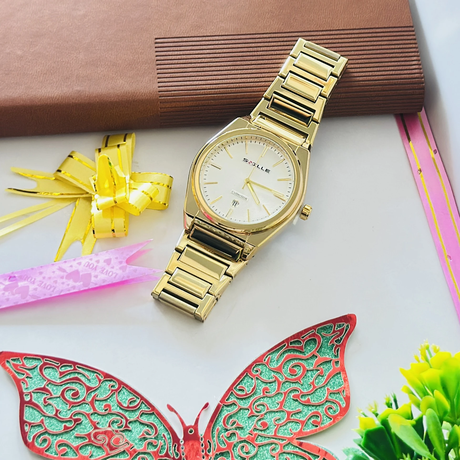 Gold colored metal strap watch