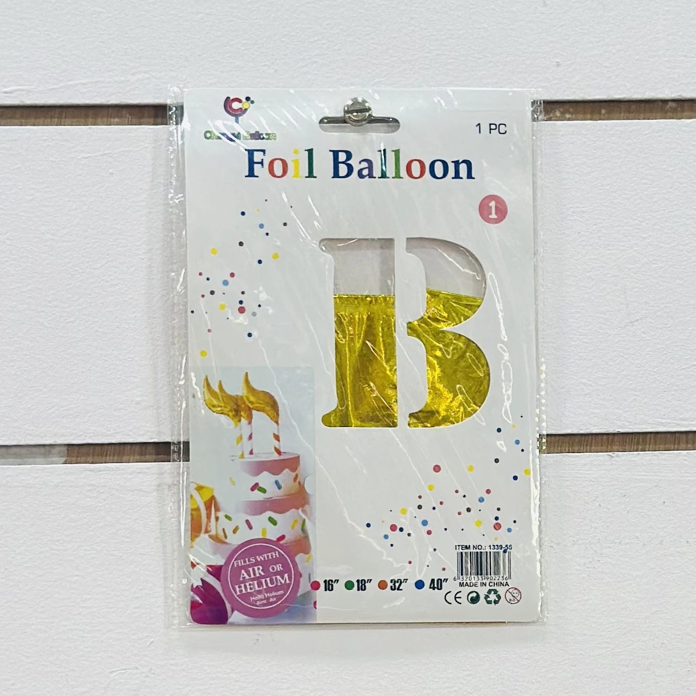 gold foil balloon shaped like the letter "B" or the number "13".