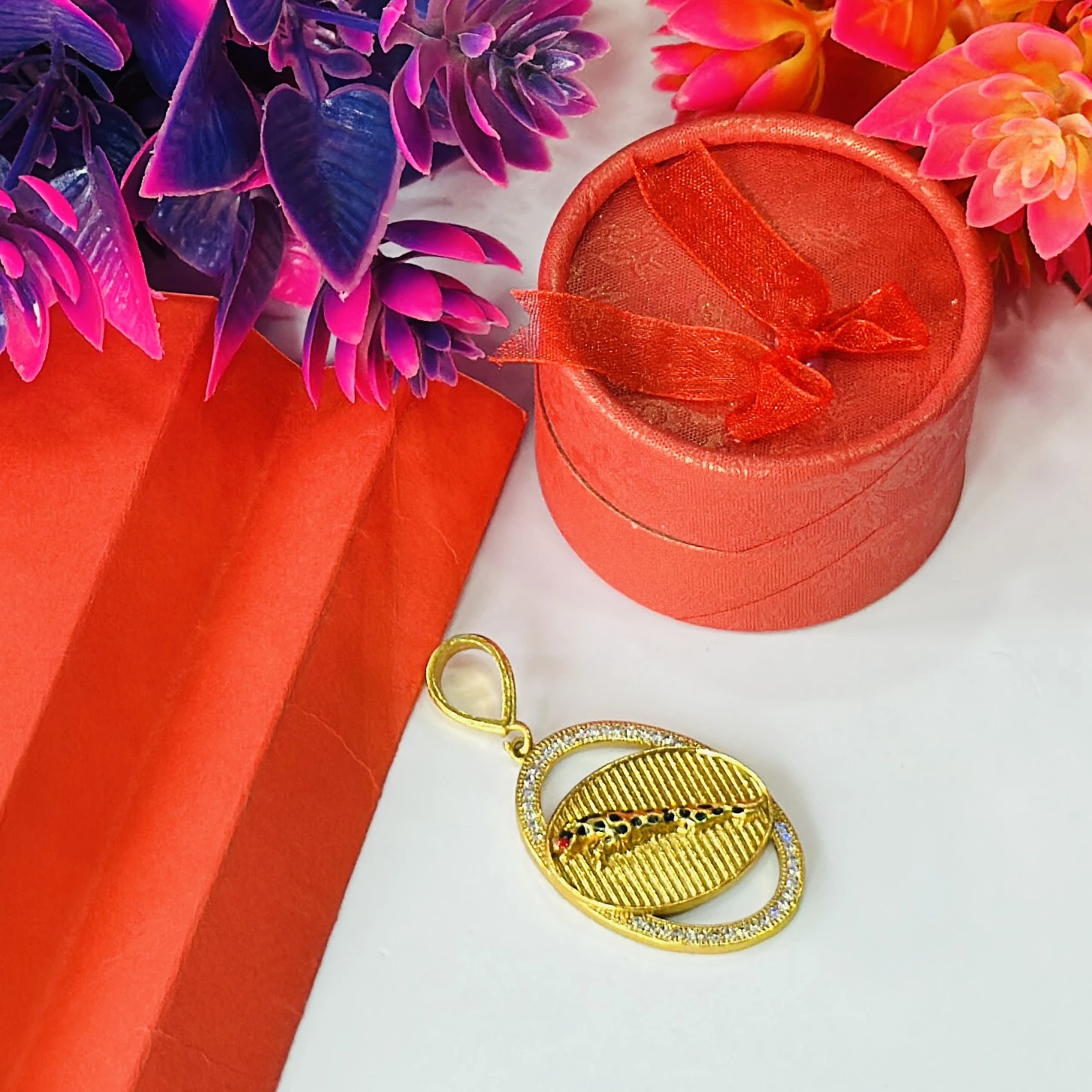 Gold plated pendant featuring a jaguar design.