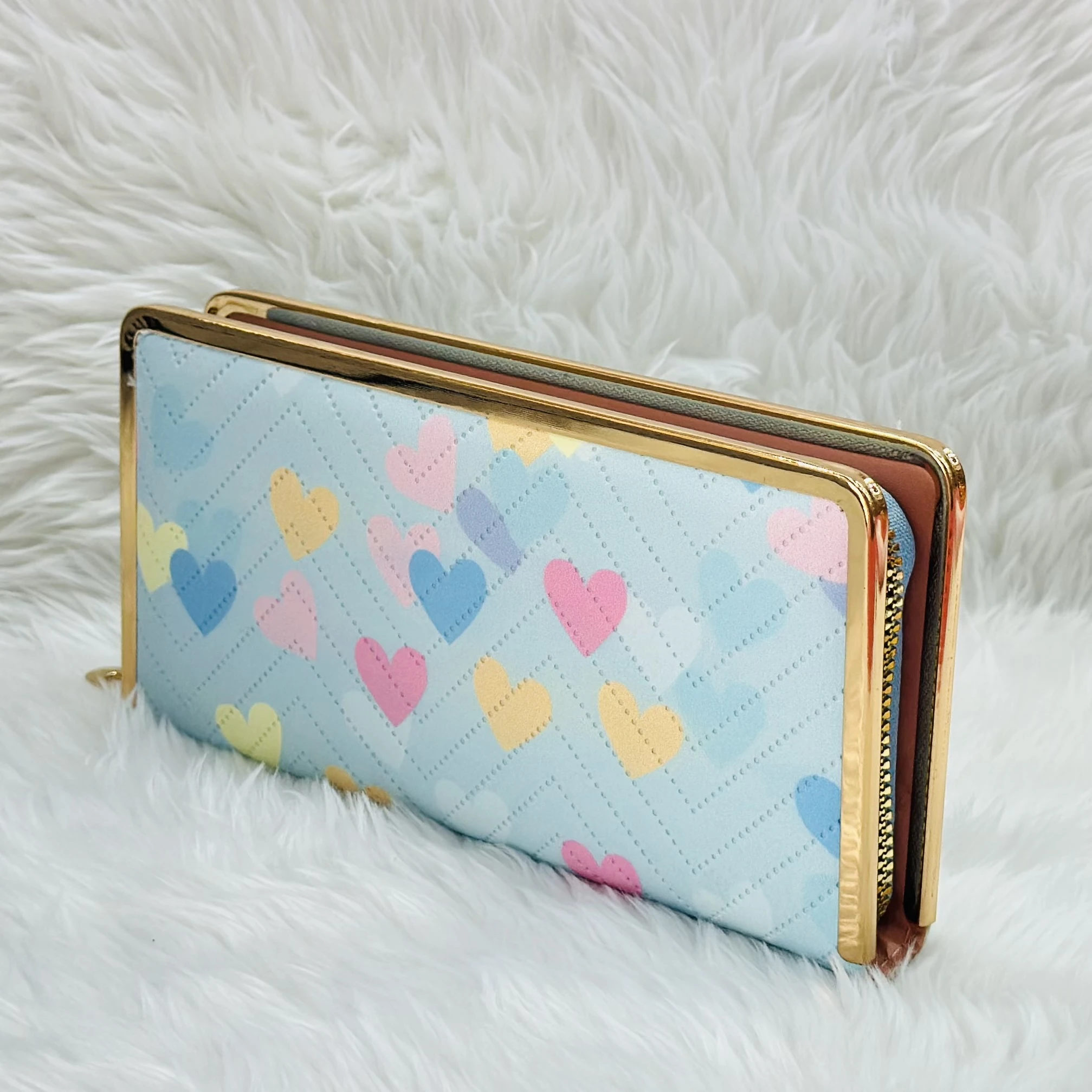 Kyraton women's long wallet with a light blue chevron and multi-colored heart pattern.