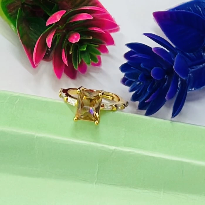 Gold plated ring with a yellow gemstone