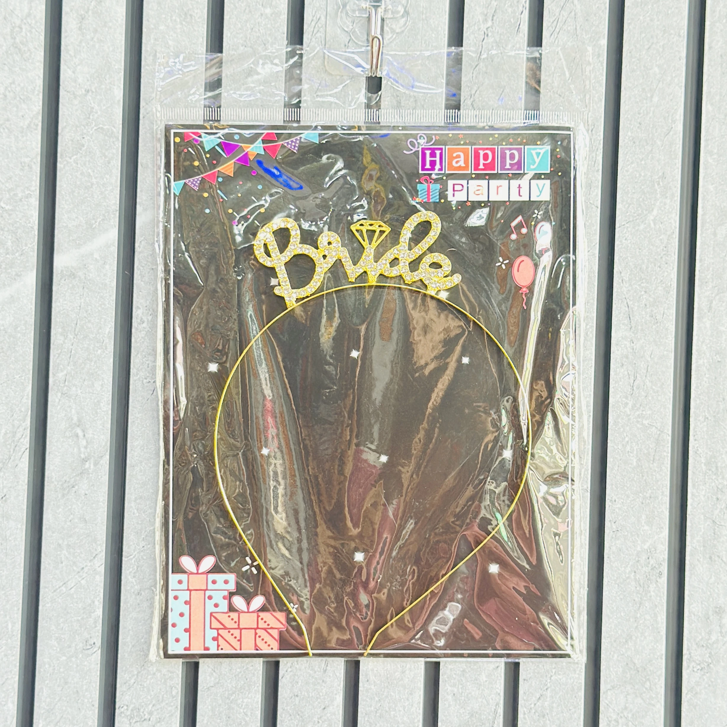 Golden metal headband featuring the word "Bride" and a small diamond
