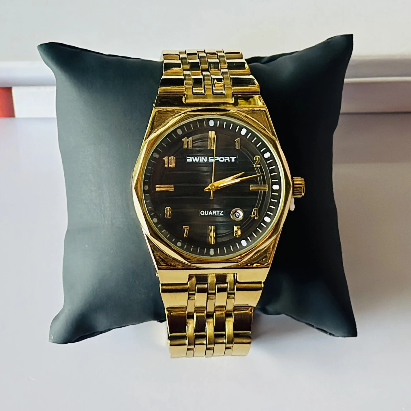 Gold tone AWIN SPORT quartz analog watch for men with a metal strap.
