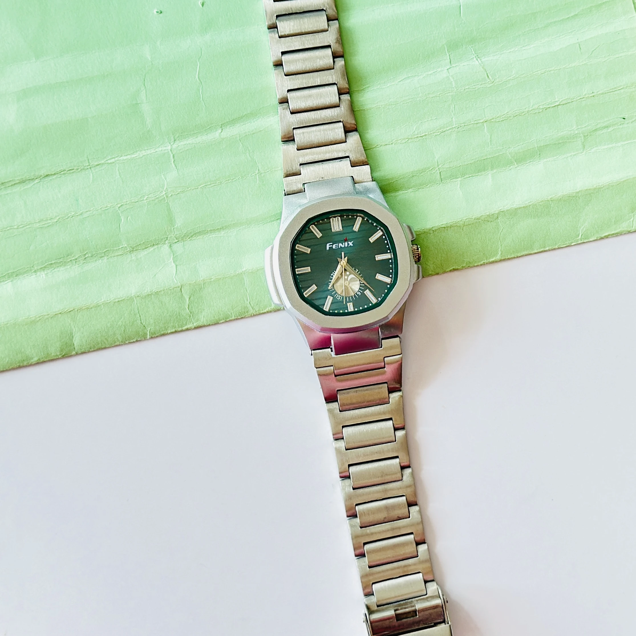 silver-toned stainless steel analogue watch