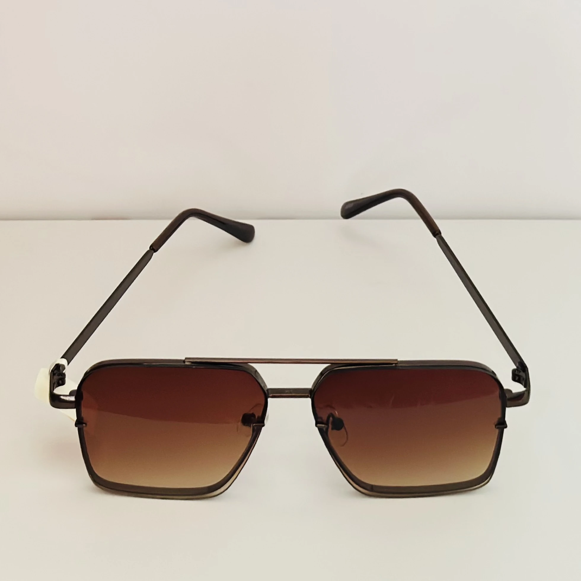 pair of square aviator gradient sunglasses with a brown metal frame.