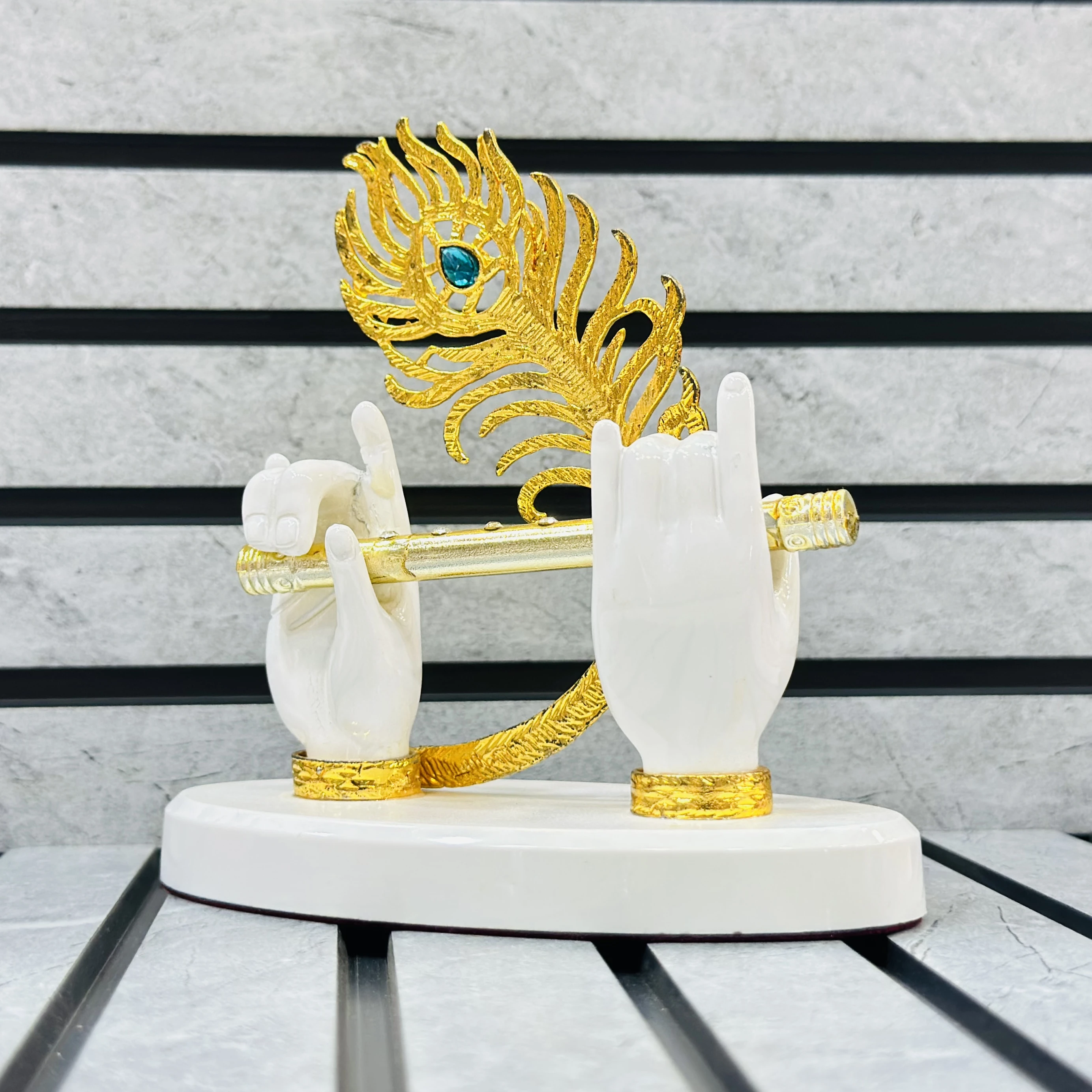 Gold gold-plated Lord Krishna hands with flute and peacock feather figurine.