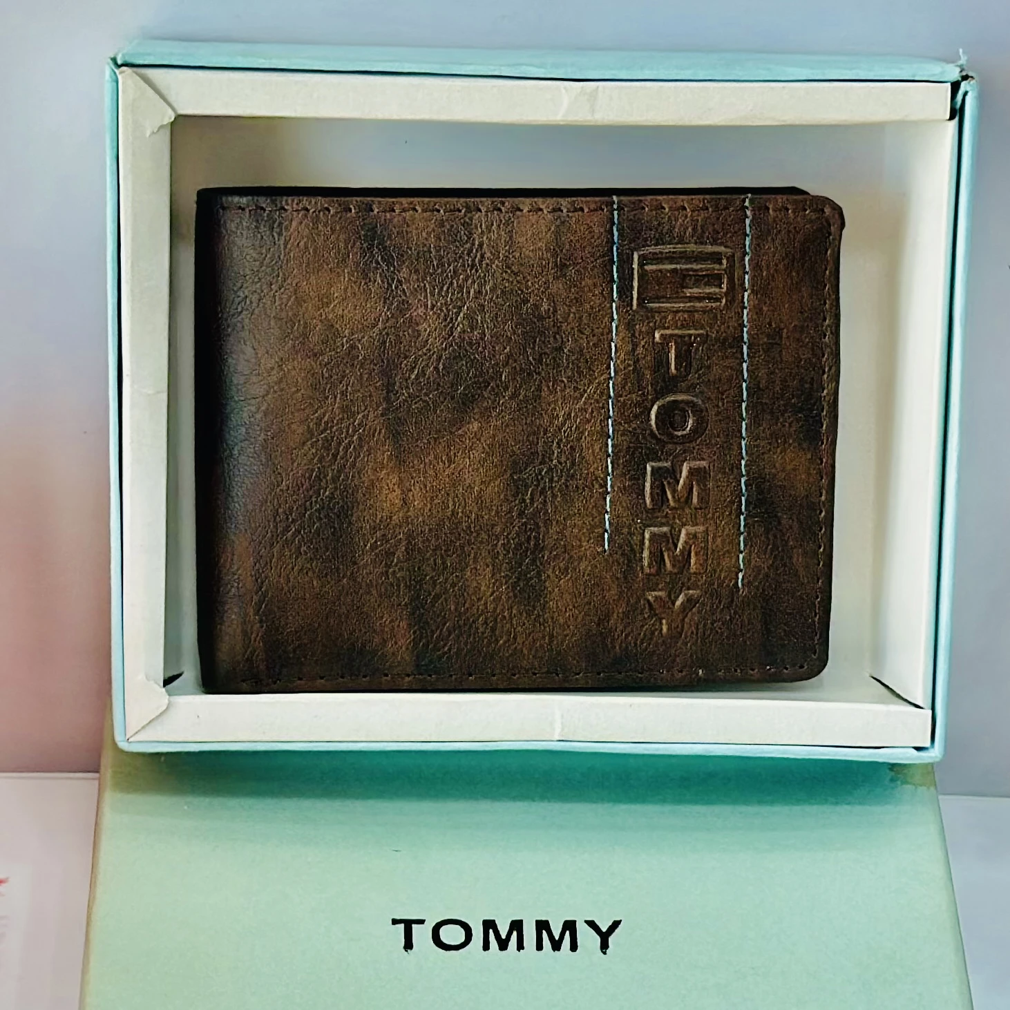 Brown bifold wallet from the brand Tommy.