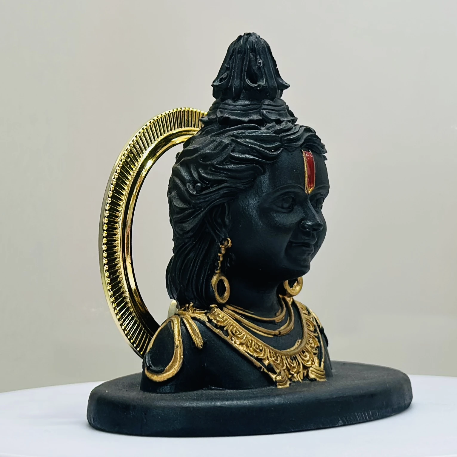 black resin idol of Ram Lalla (Lord Rama as a child).