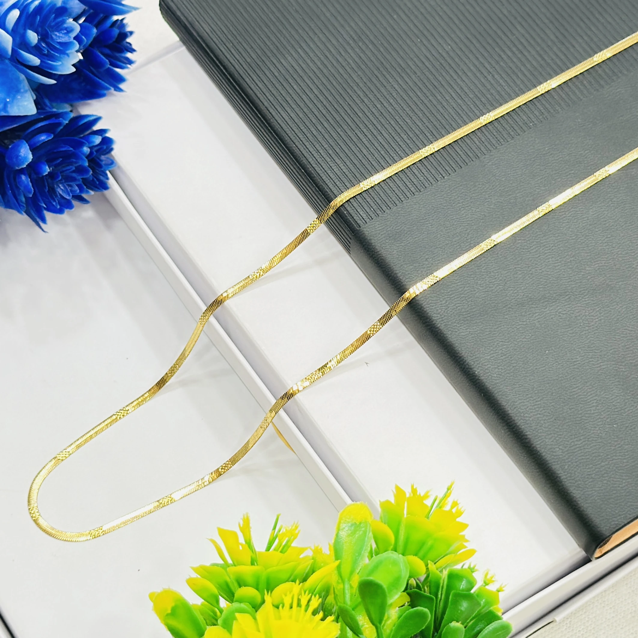 premium gold-plated herringbone snake chain.