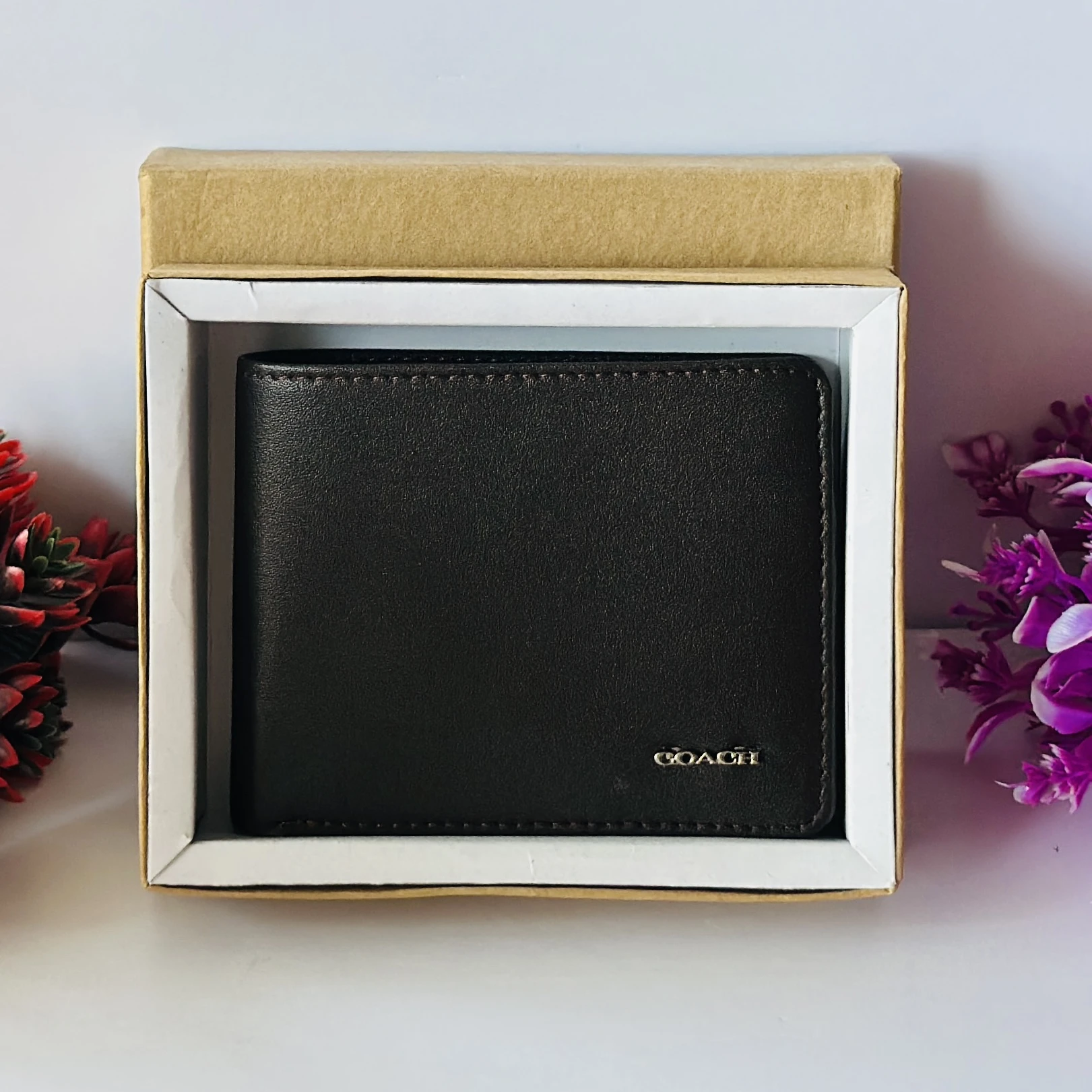 Brown Coach bifold wallet.
