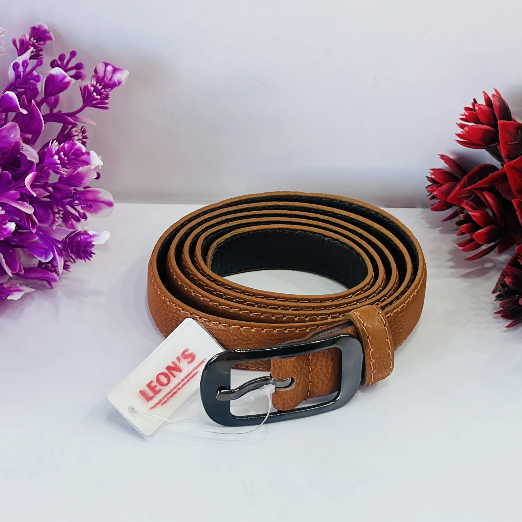 Tan casual leather belt with a needle pin buckle.