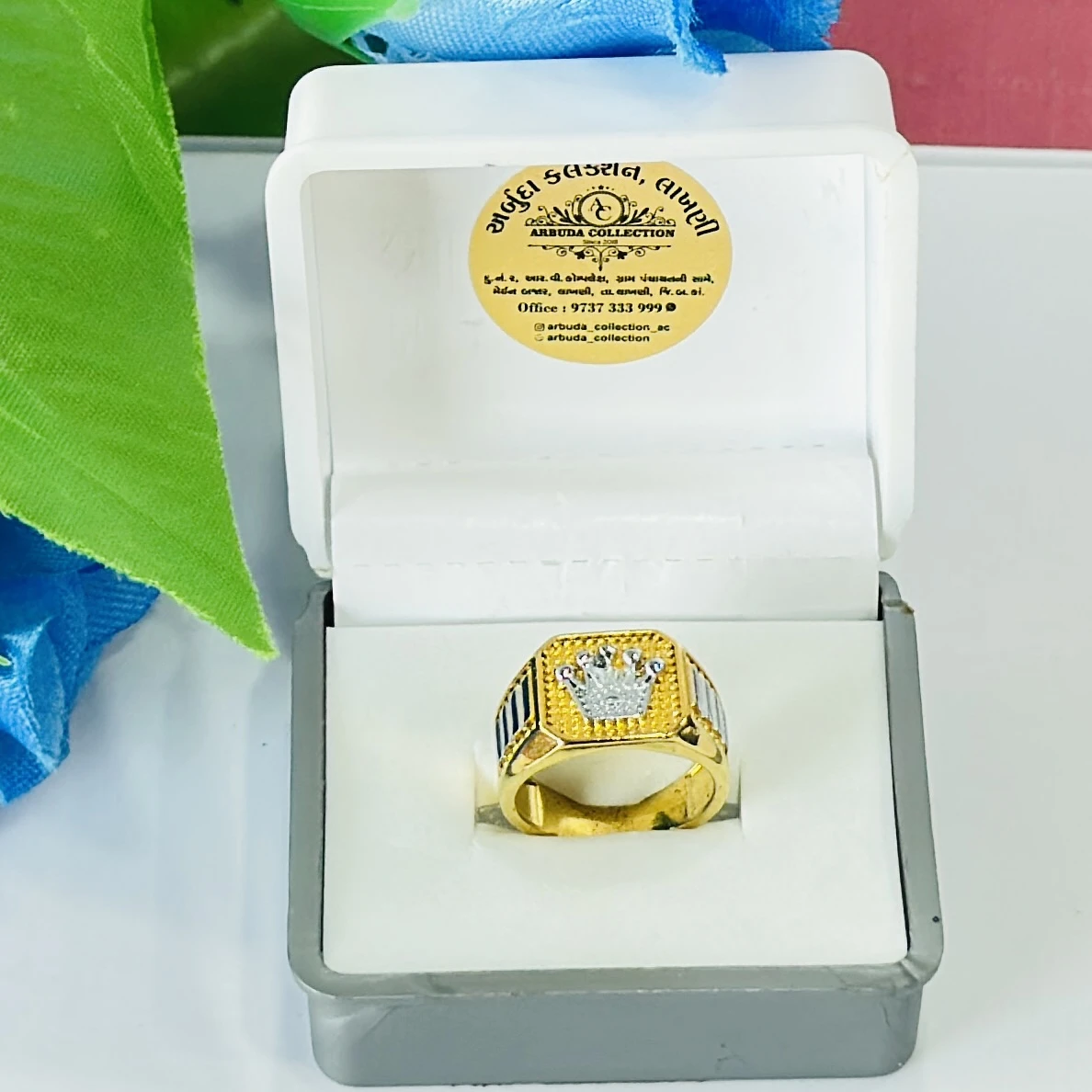 Gold toned men's crown ring