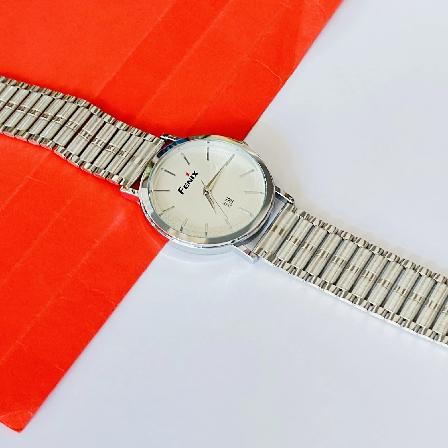 silver-toned stainless steel analogue watch