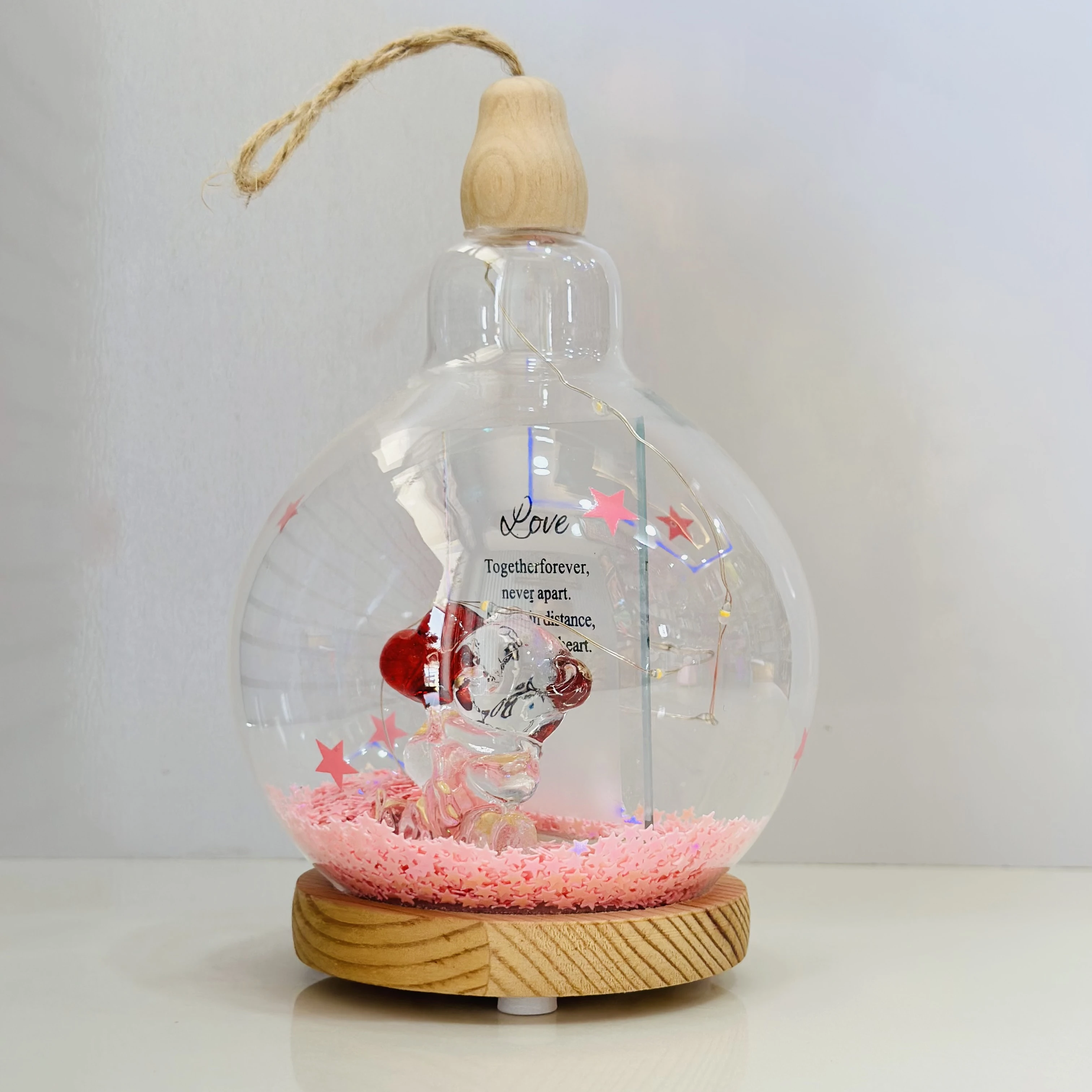 decorative glass dome with LED lights, featuring a couple figurine inside.(SKU-5NELVH)