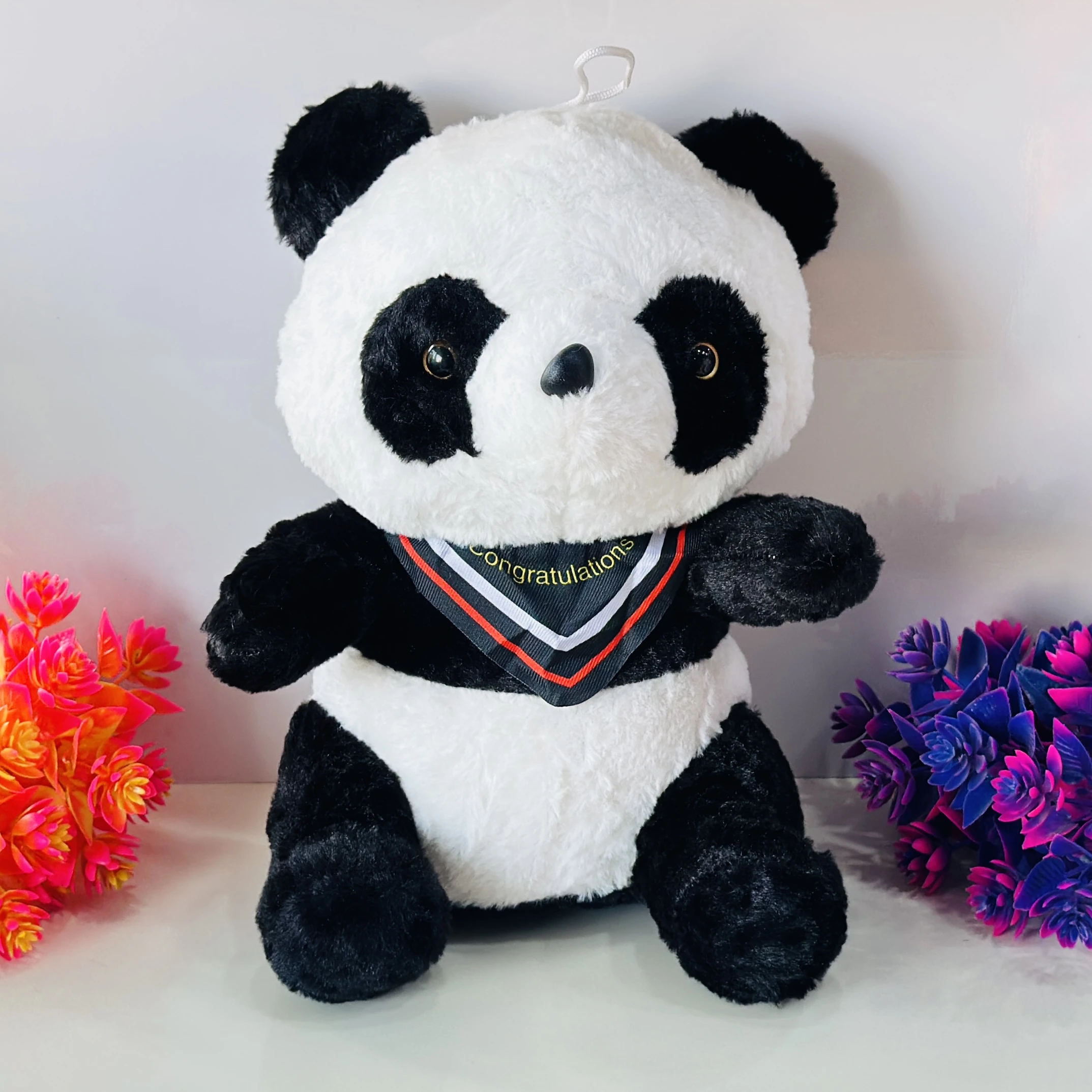 soft panda plush toy with a decorative "Congratulations" collar