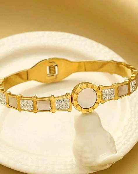 stainless steel gold-plated mother of pearl Roman numerals AD studded bracelet.