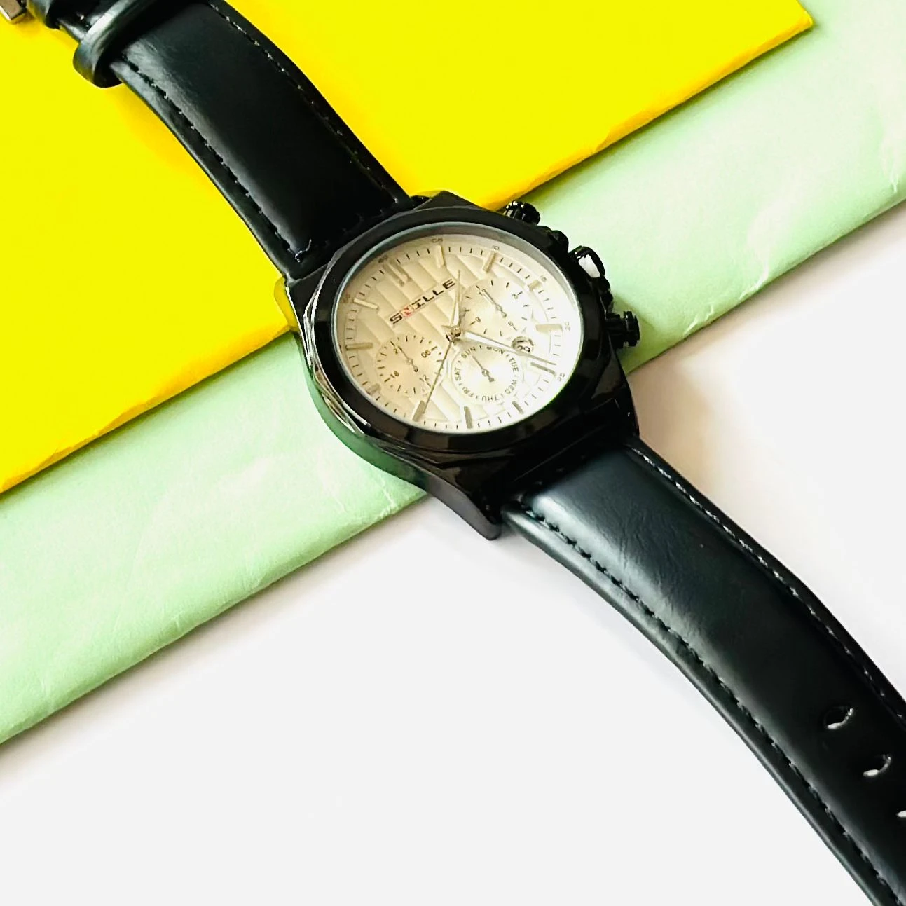 Forest quartz analog watch with a gold-tone mesh strap and a white dial.