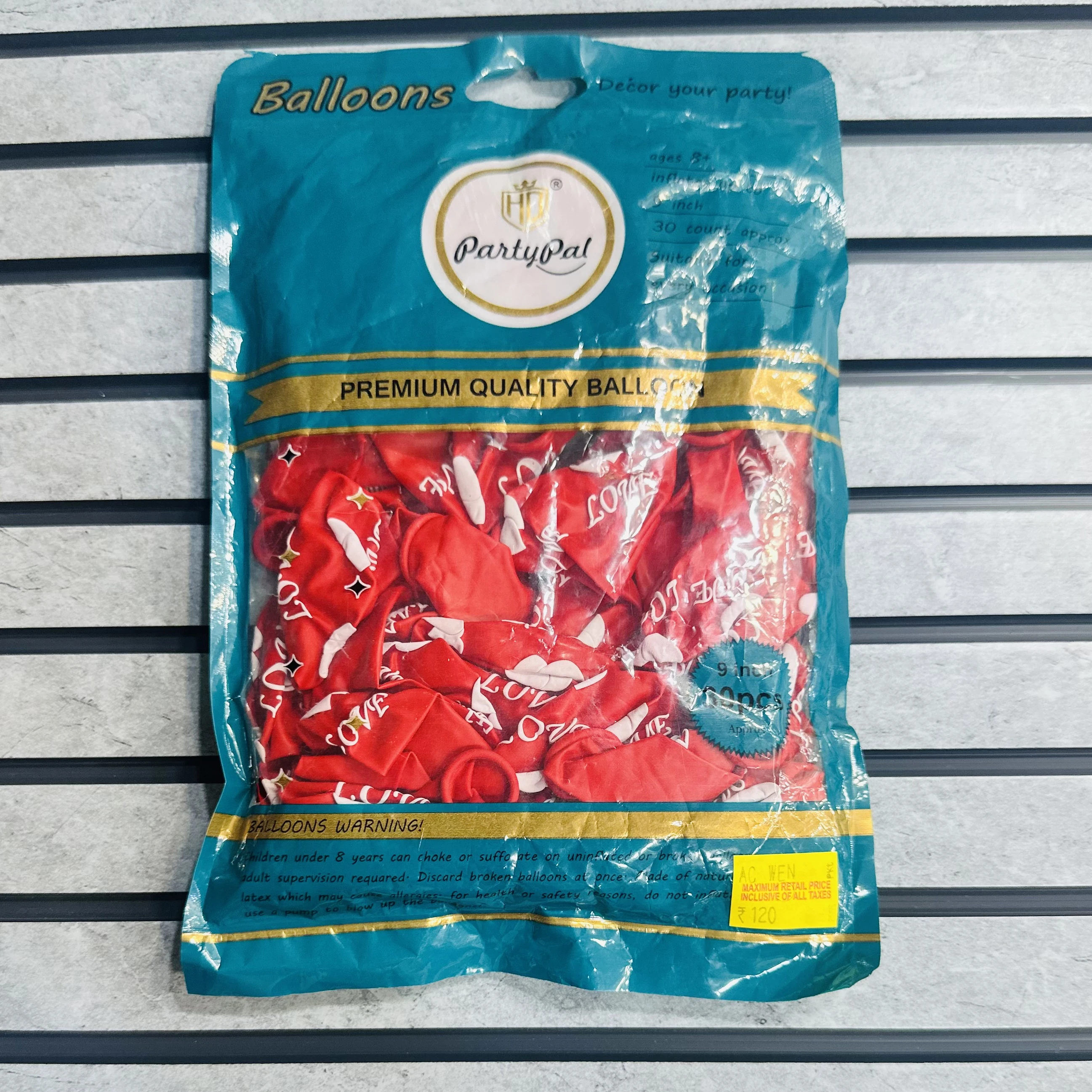 package of red "LOVE" balloons.