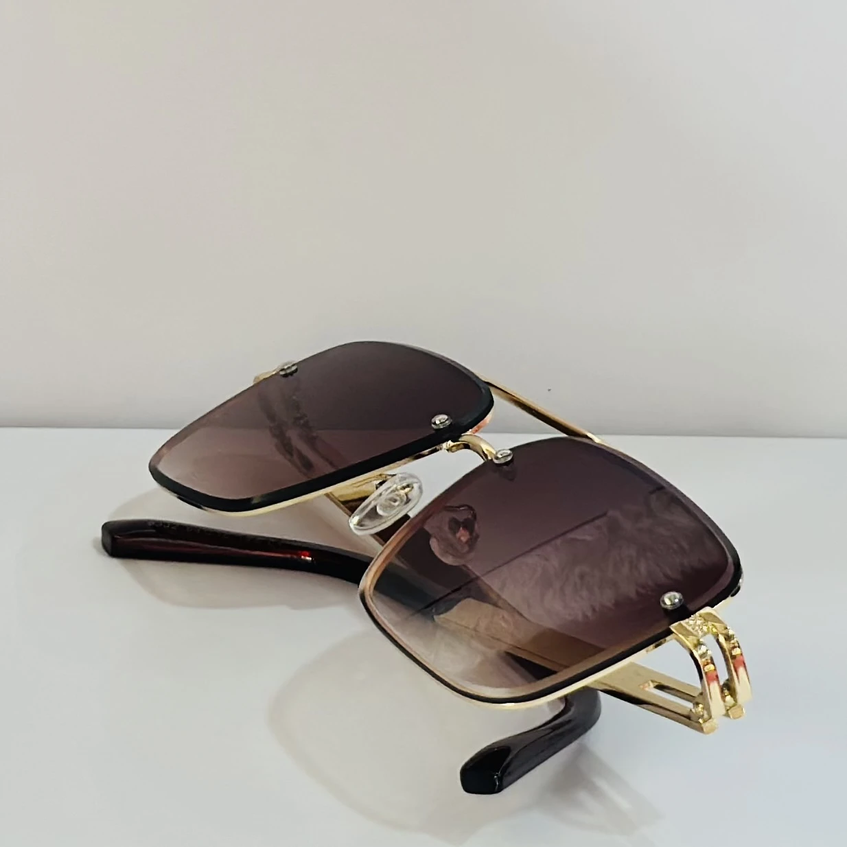 pair of Maybach aviator sunglasses with a gold-tone frame and brown gradient lenses