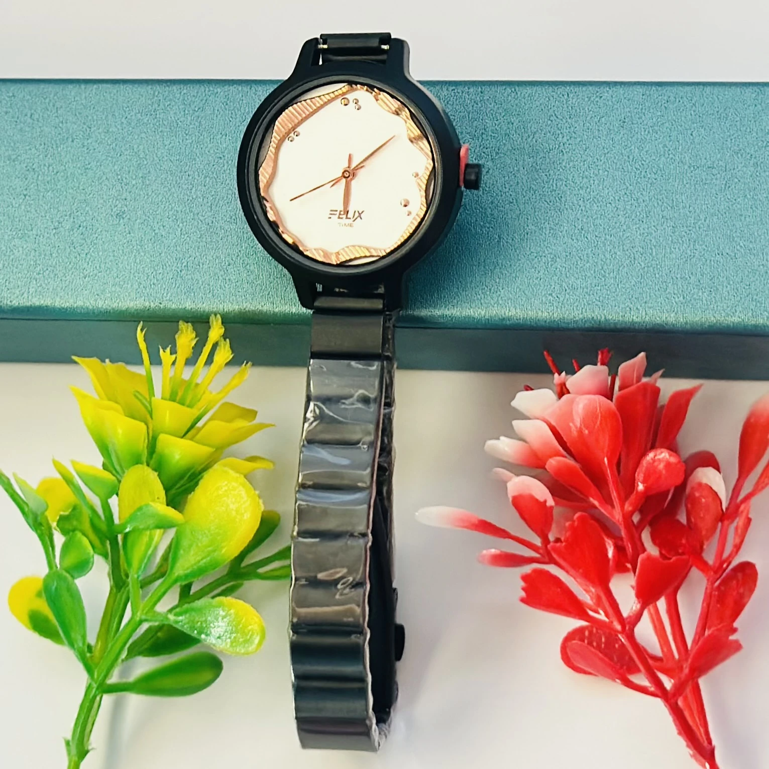 Felix Time analog watch for girls with a fancy metal strap.