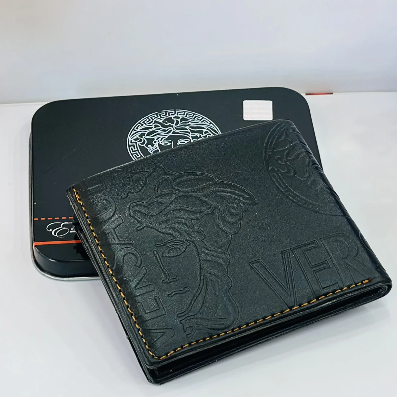 Versace Medusa Biggie bi-fold wallet in black leather.