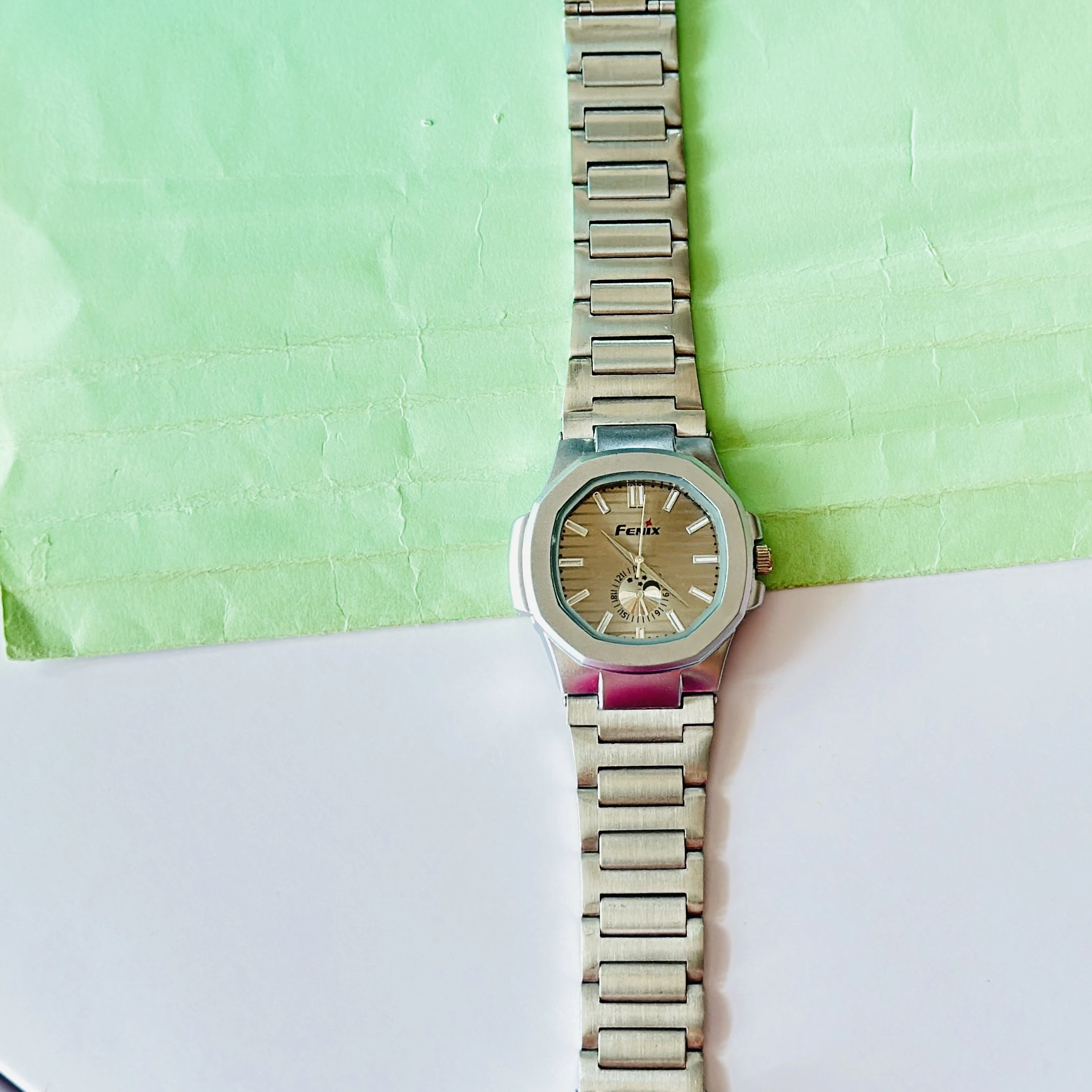 silver-toned stainless steel analogue watch