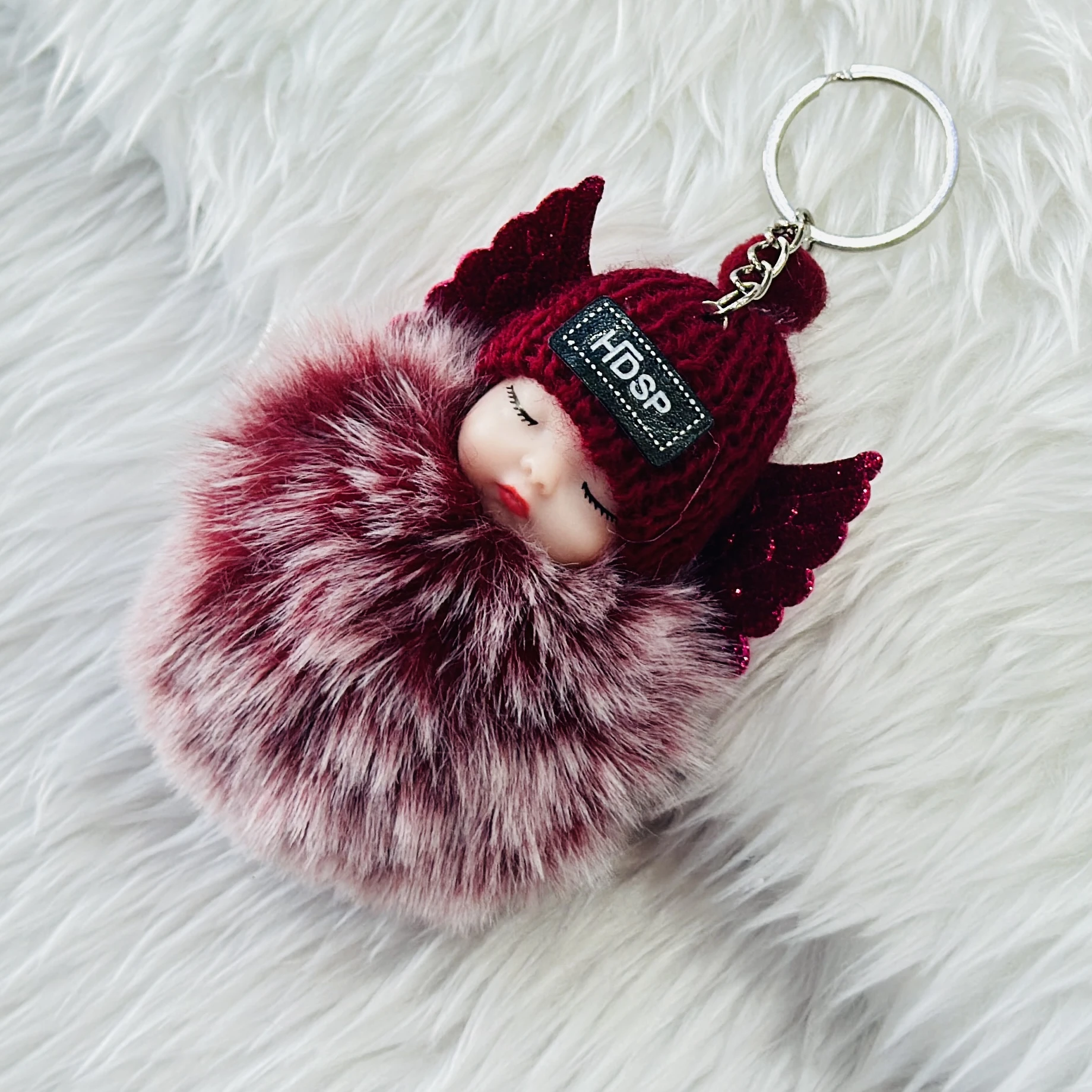 sleeping baby doll keychain