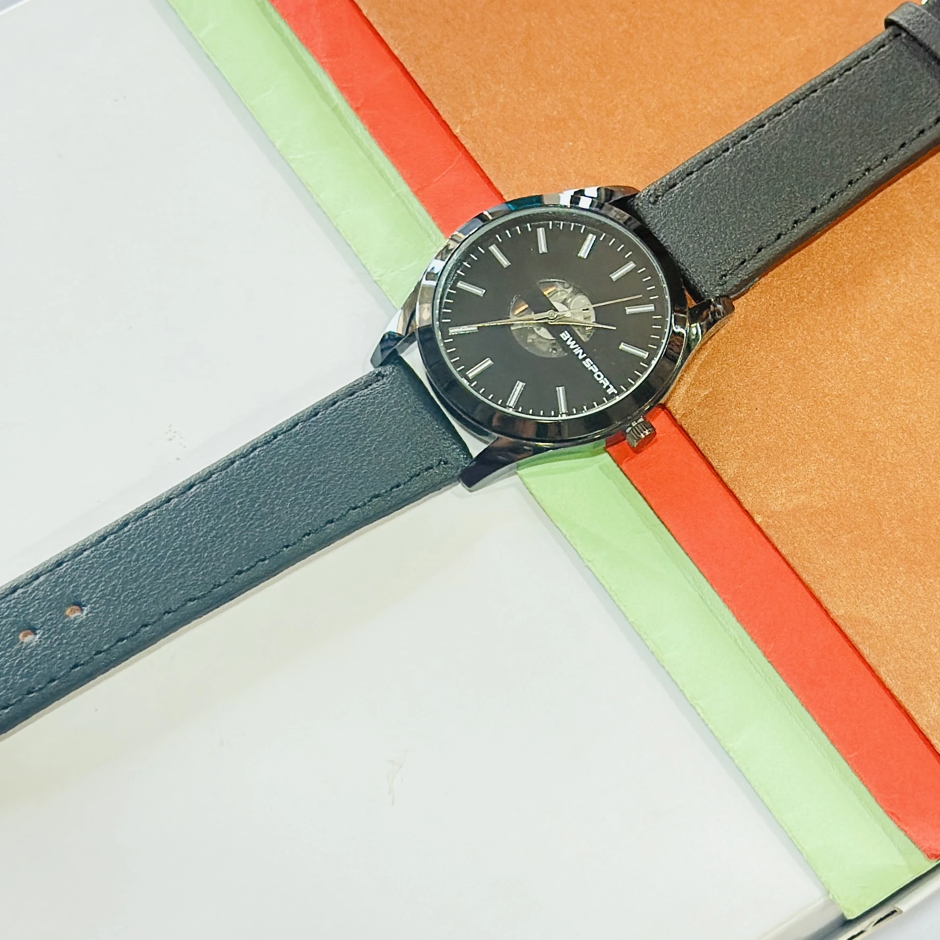 appears to be a BWIN SPORT brand analog wristwatch