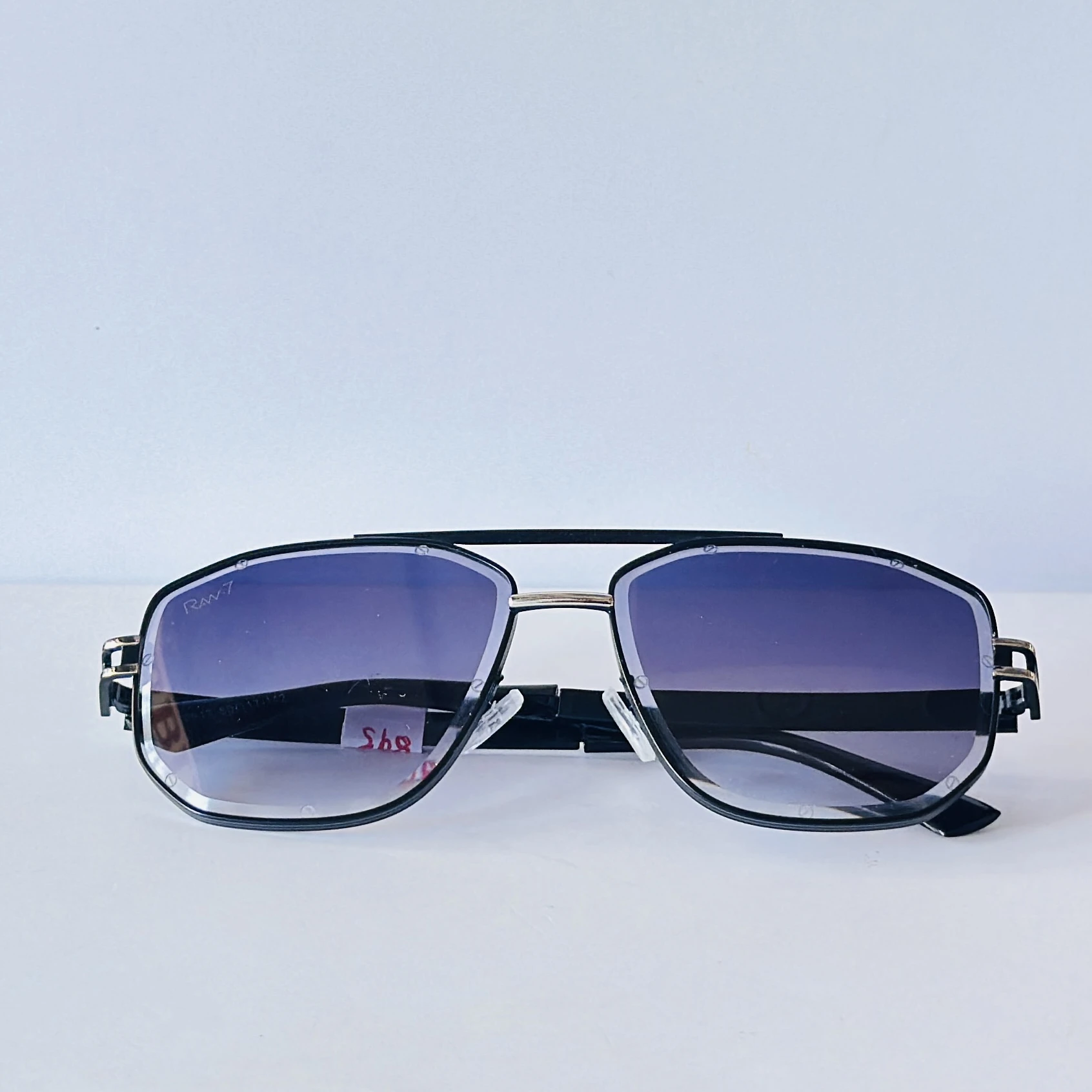 pair of Raw 7 branded men's rectangular sunglasses