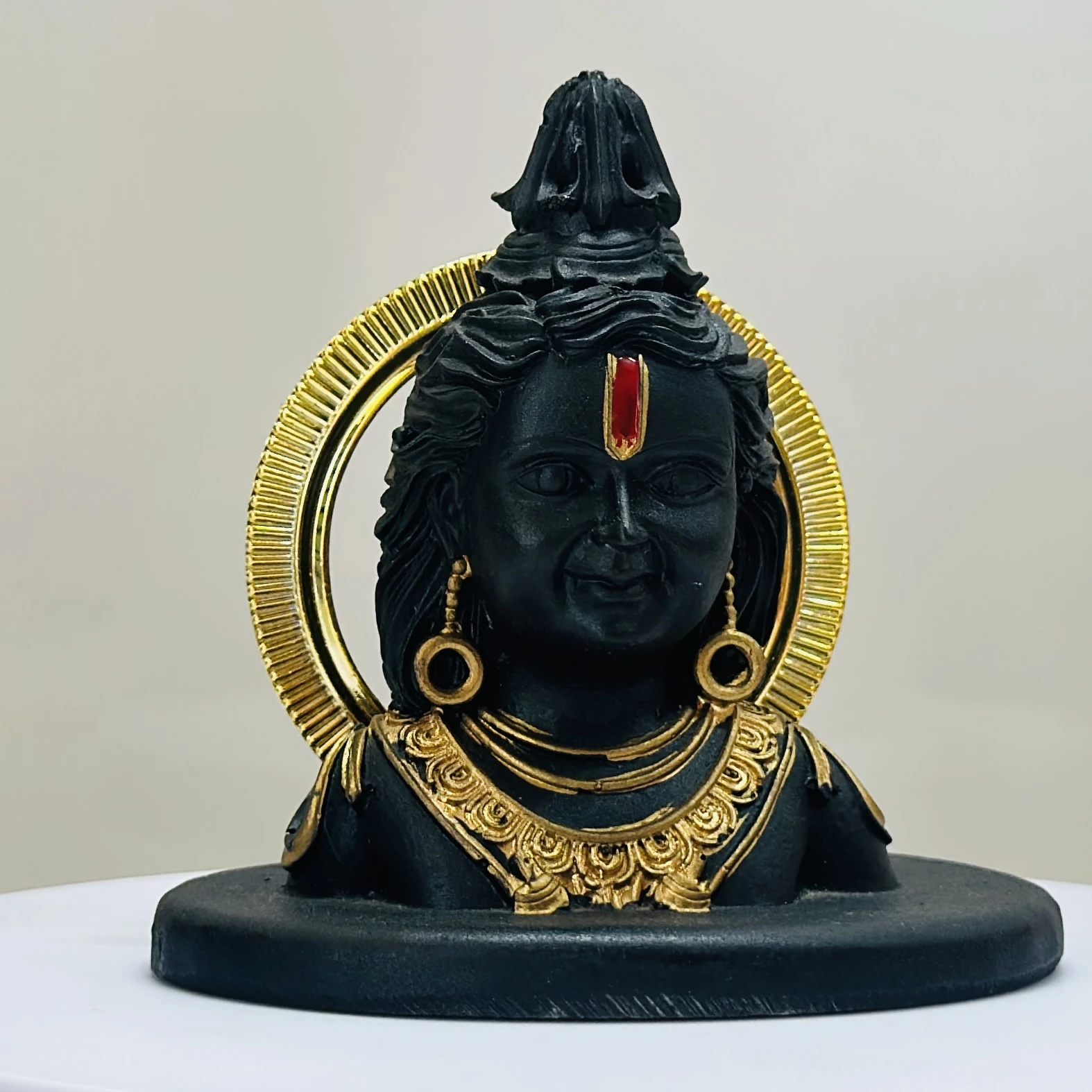 black resin idol of Ram Lalla (Lord Rama as a child).