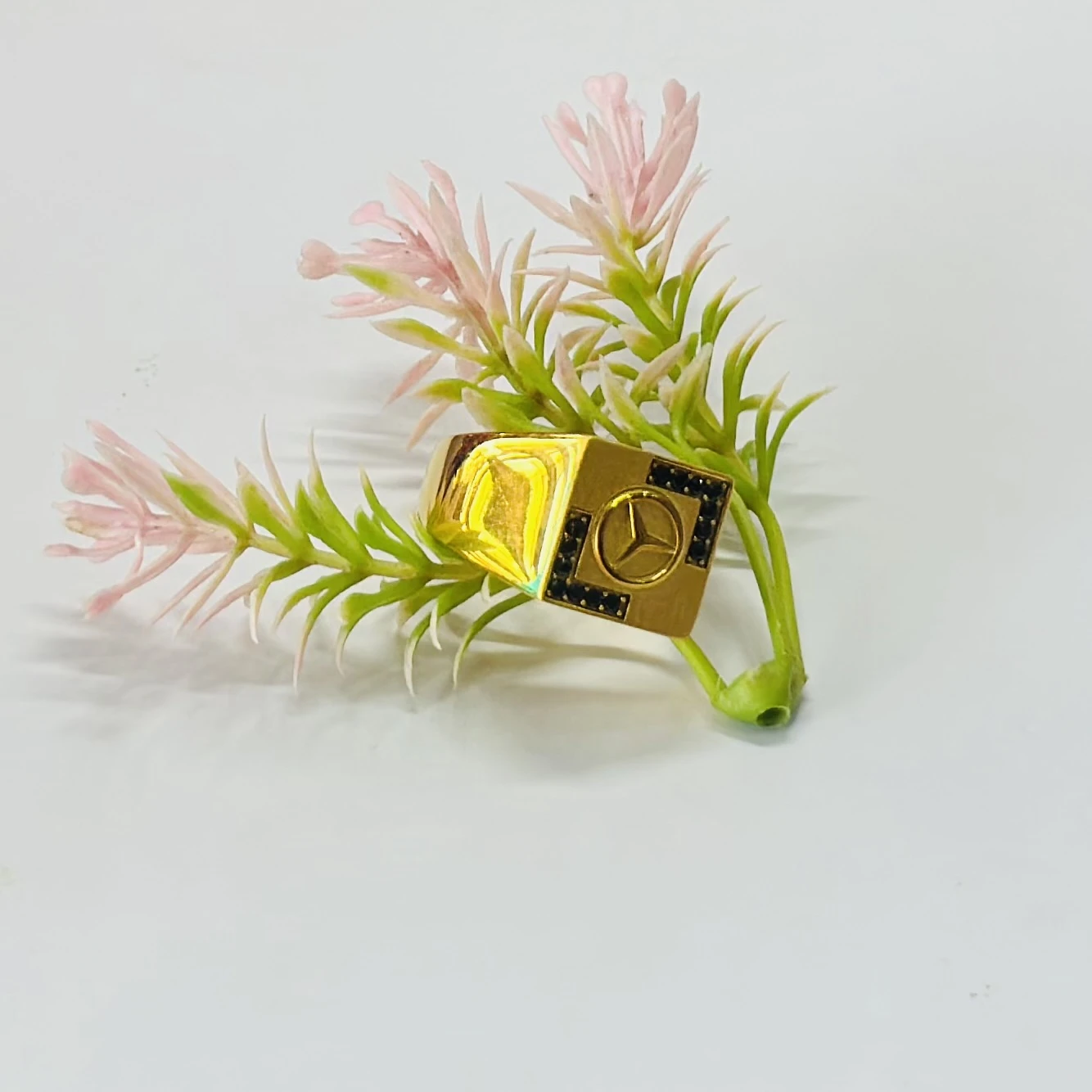 Men’s ring featuring the Mercedes-Benz logo and black accent stones