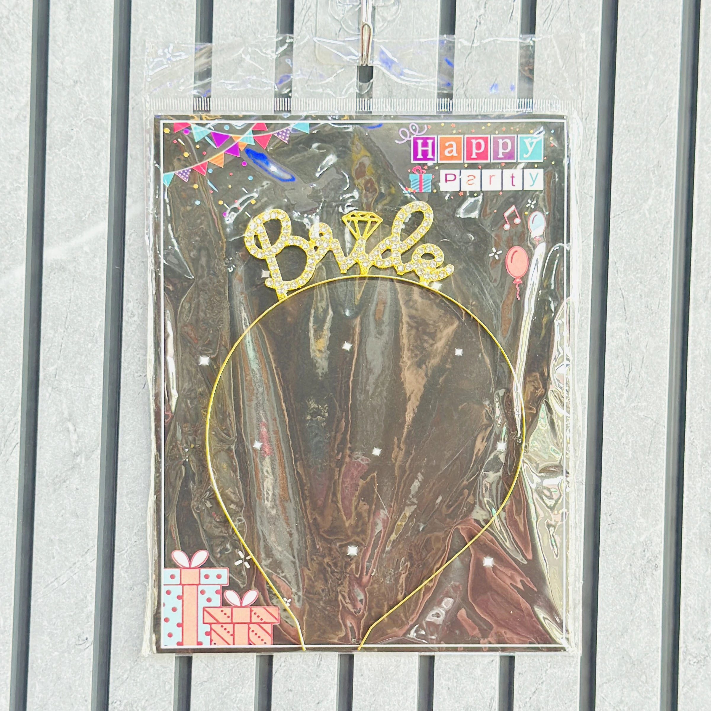 Golden metal headband featuring the word "Bride" and a small diamond