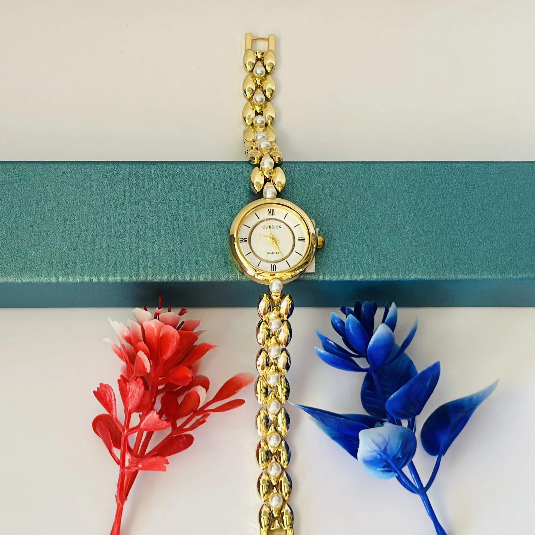 Gold tone women's bracelet watch