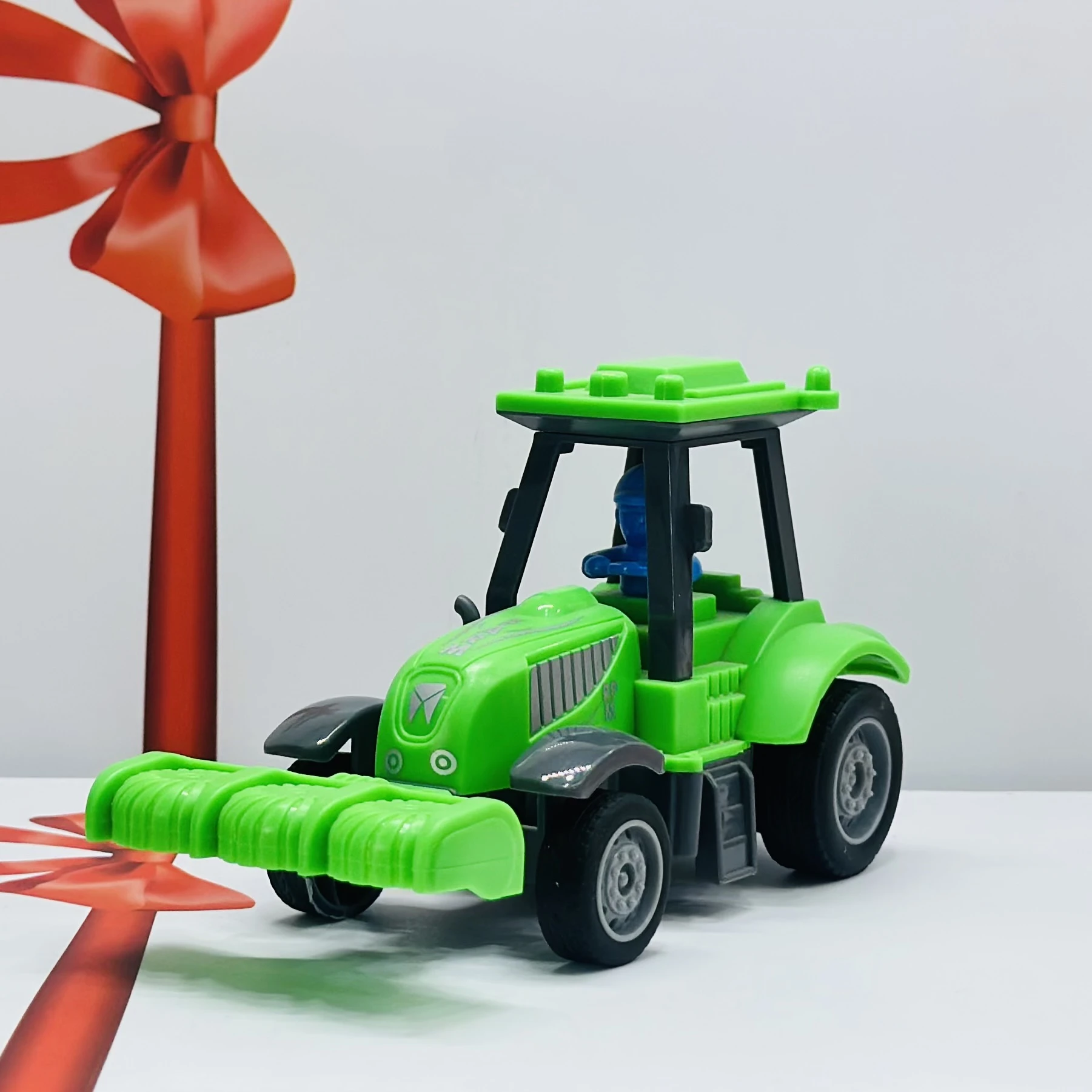 Green plastic toy tractor