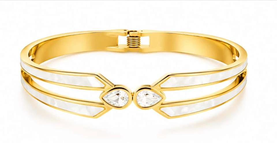 Gold tone hinged bangle bracelet