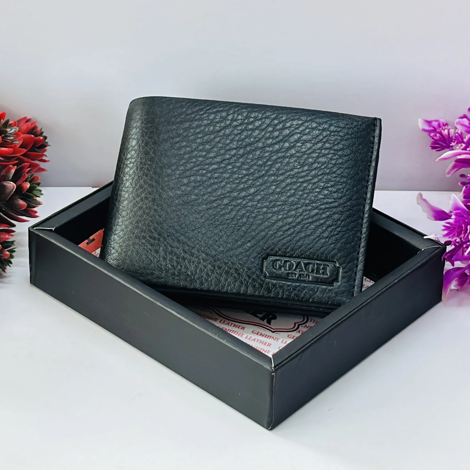 Coach men's black leather slim bifold wallet.
