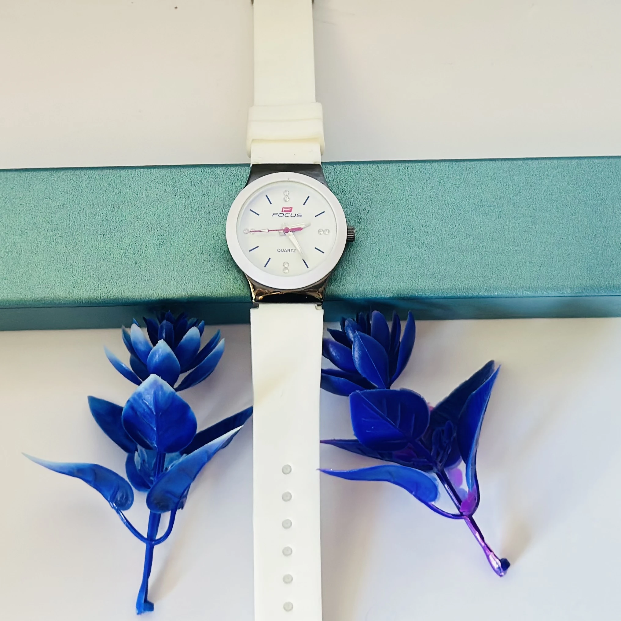 White Focus quartz analog watch for women with a white leather strap.